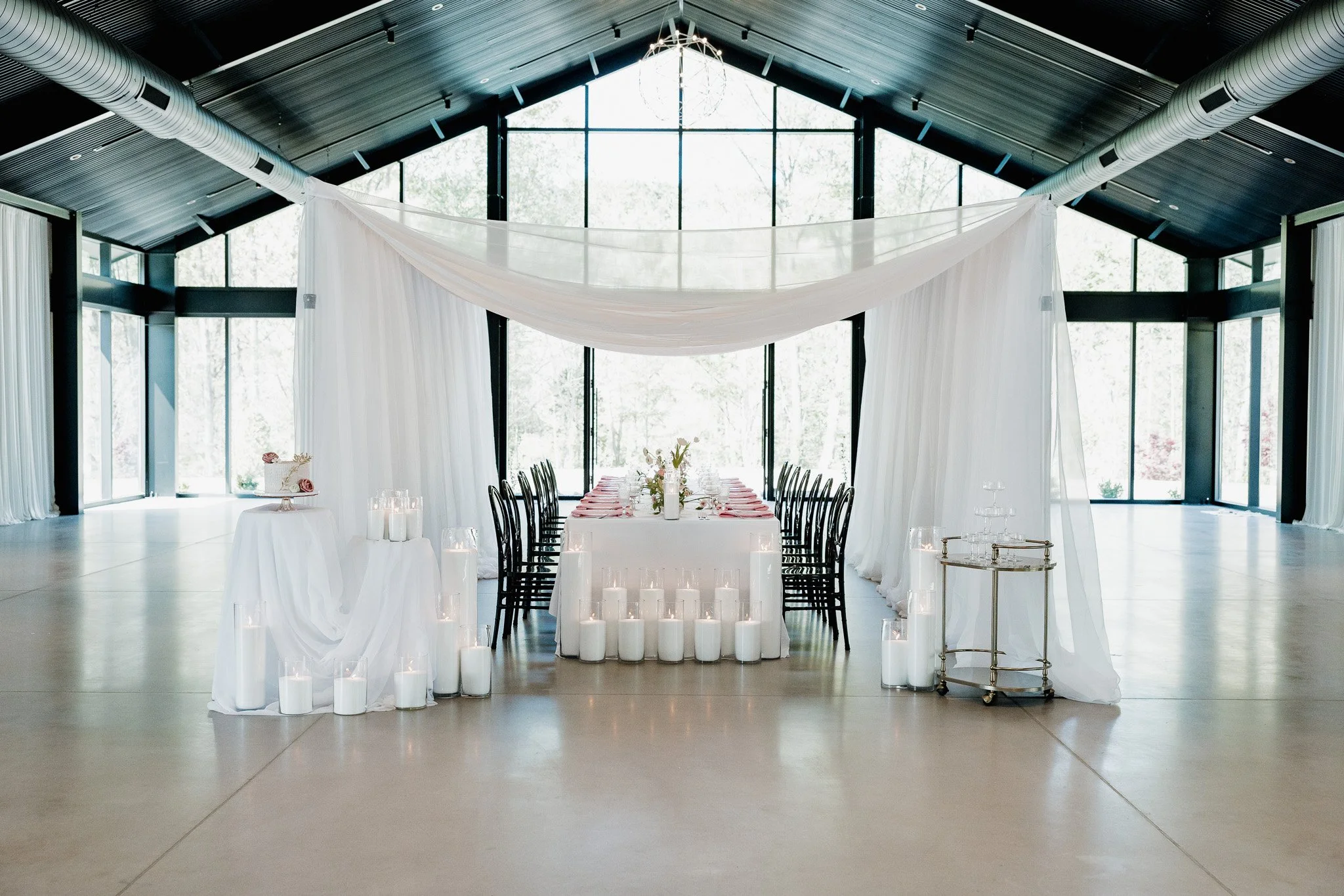 Elegant wedding reception setup with candles and florals at The Skyroom Wedding Venue