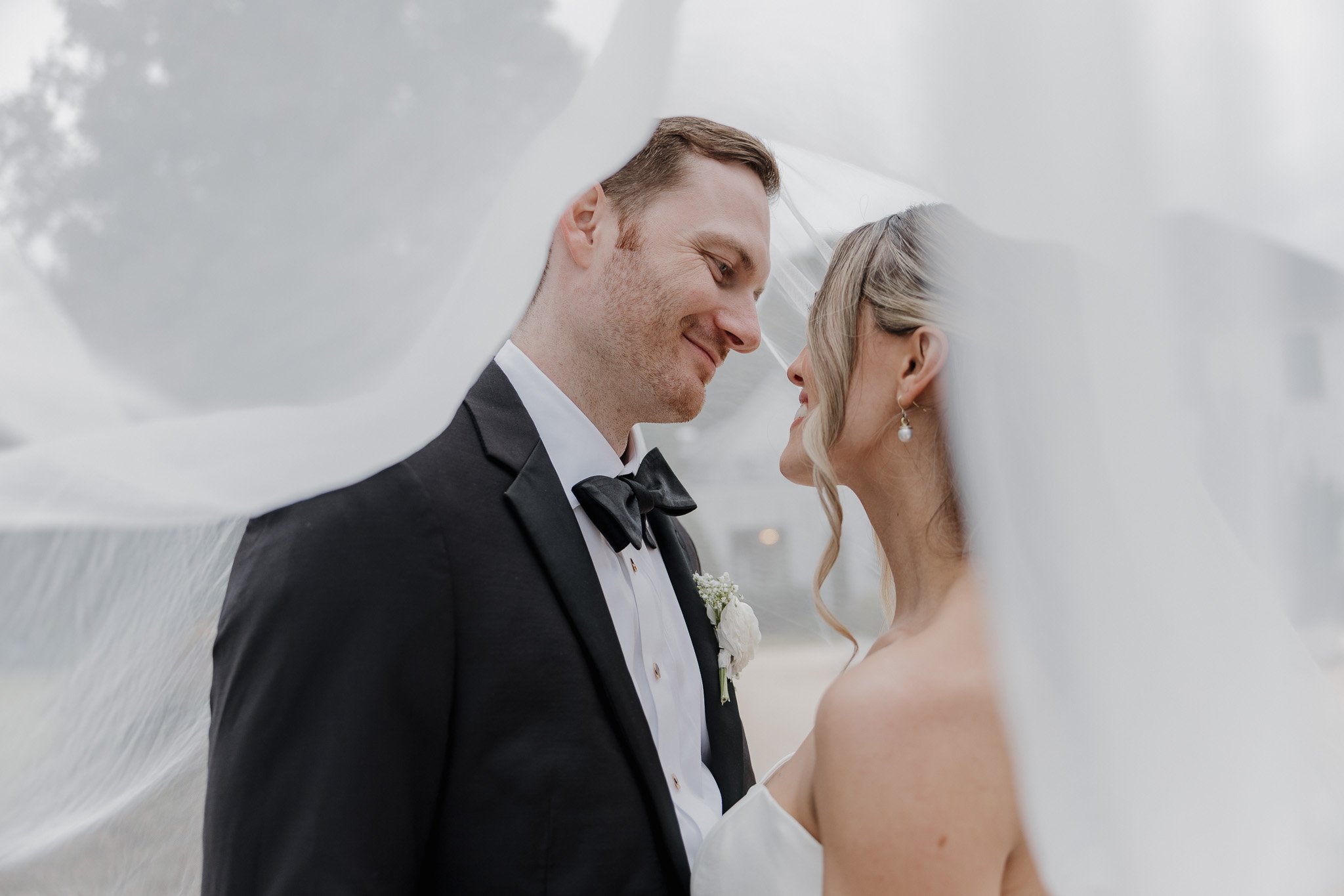 Lucy and Drew sharing a quiet first look outside The Bradford in Raleigh, NC