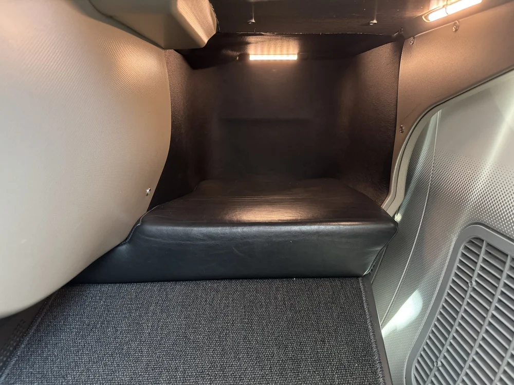   Long, padded footwell, lights can be turned off. Does not feel cramped.  