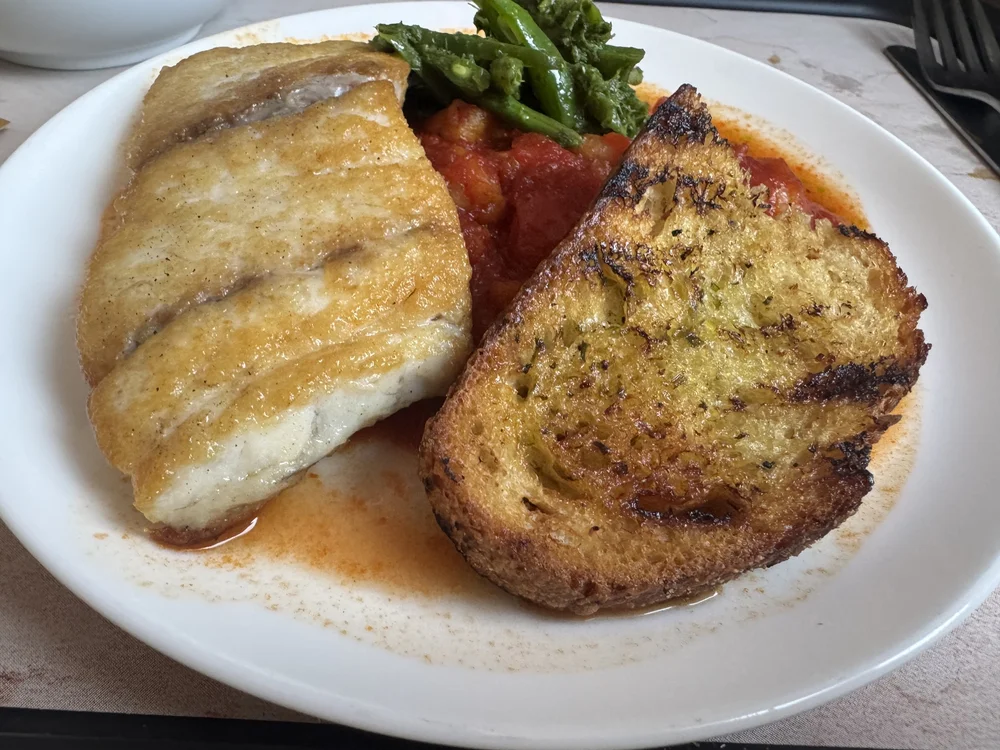  Seared barramundi, perfectly cooked and well seasoned. The garlic toast was actually well toasted and not soggy or chewy as you often get on-board.   