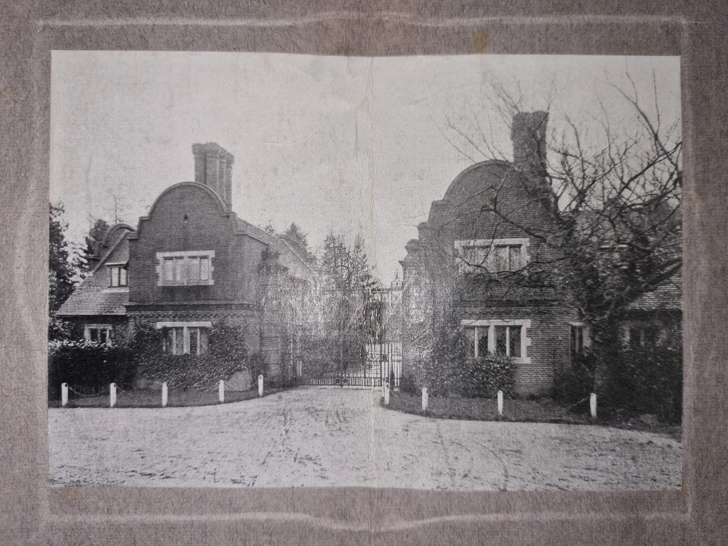Historic image of the Lanwades Hall gate lodges and entrance gate, featuring early architectural detailing.