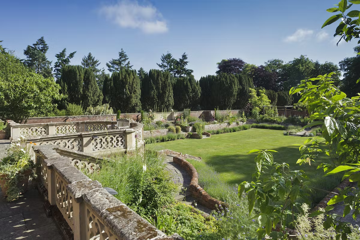 View of the landscaped gardens at Lanwades Hall, Suffolk, offering a peaceful outdoor setting for weddings, parties, and private events