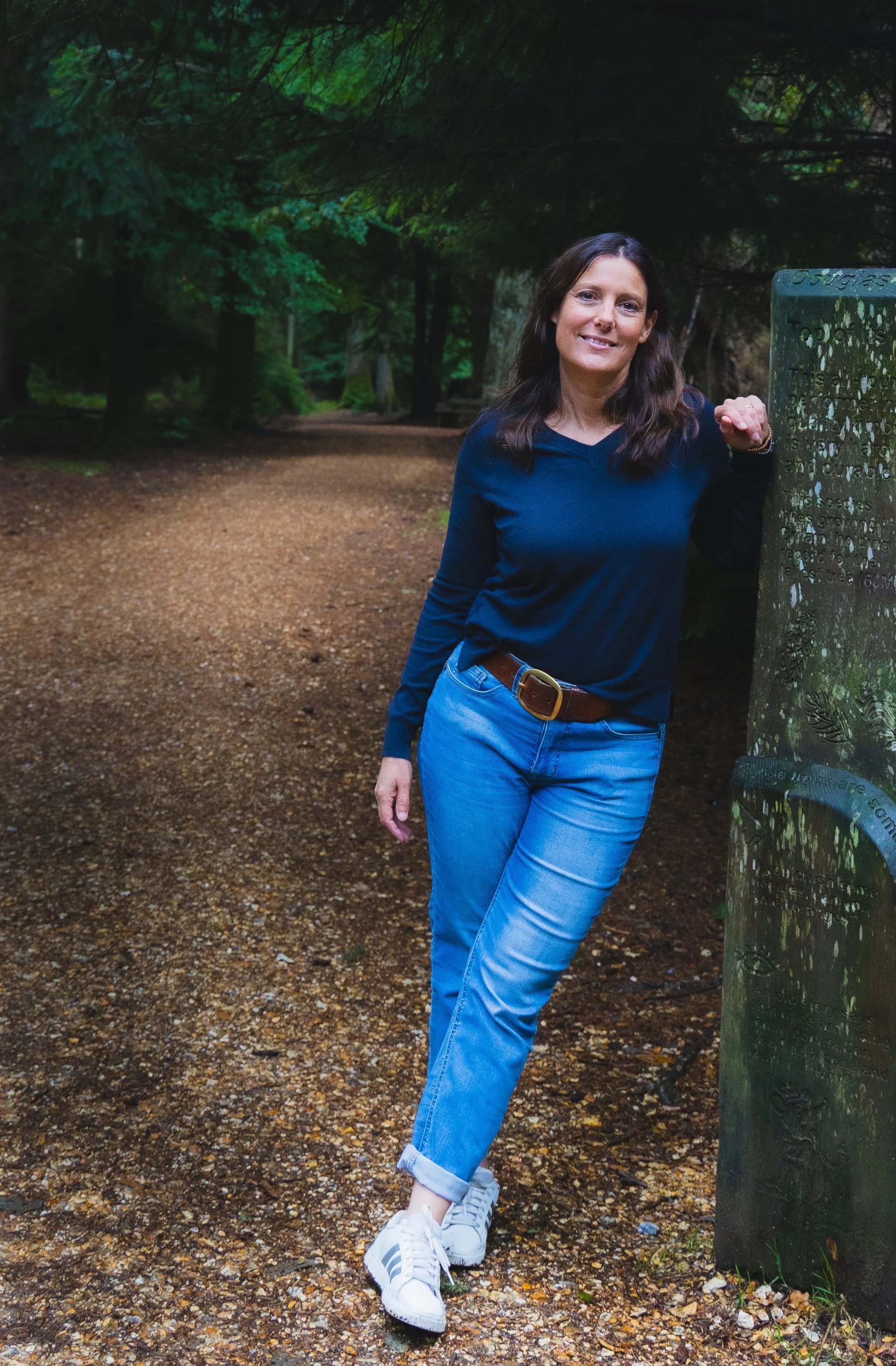 Leaning against a post