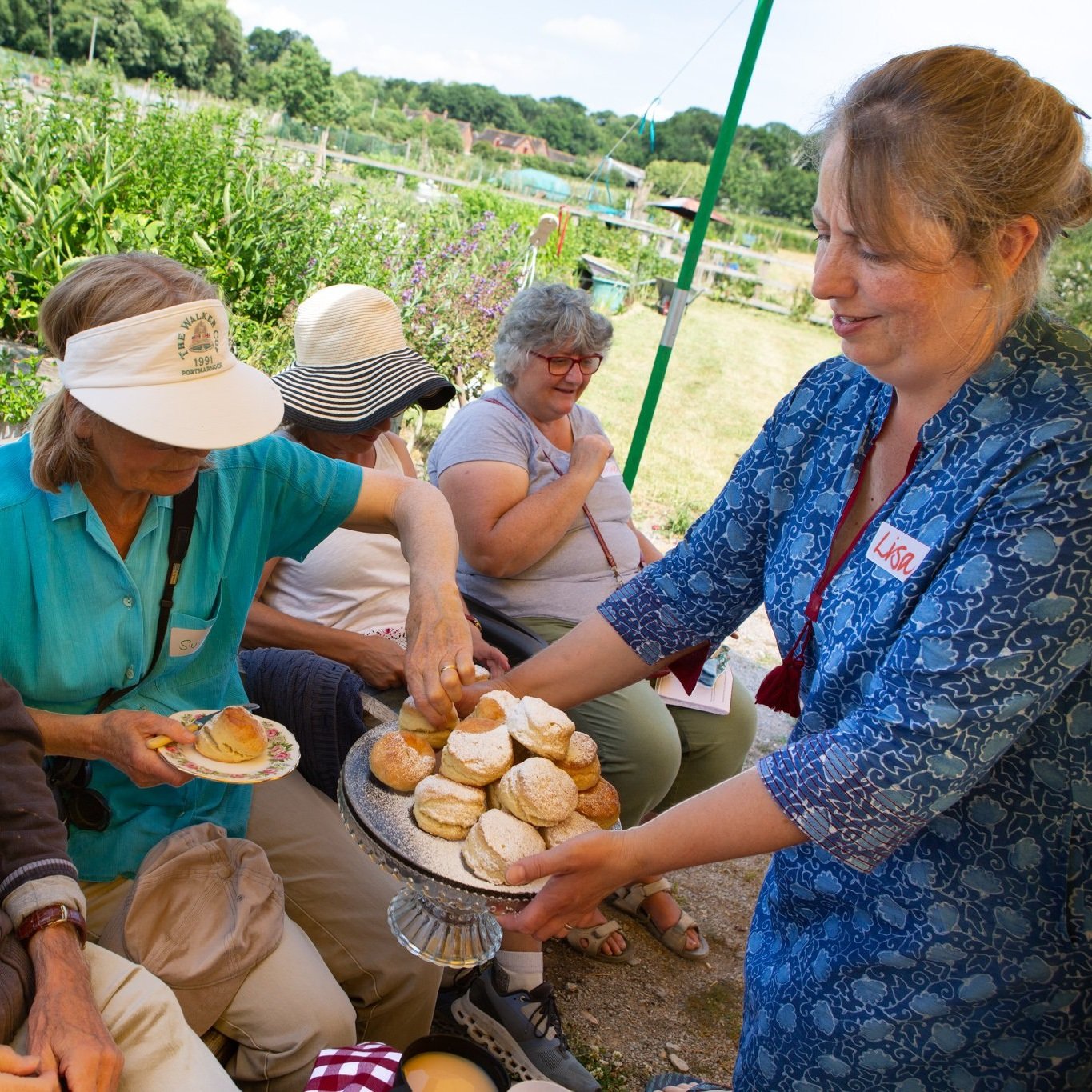 In+Jolly+Good+Company+-+Cream+Tea+at+the+allotment+-+Lisa+serving+the+scones.jpg