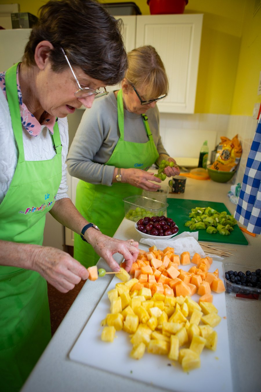 Liz and Claire prepare the fruit kebabs for the picnic.jpg
