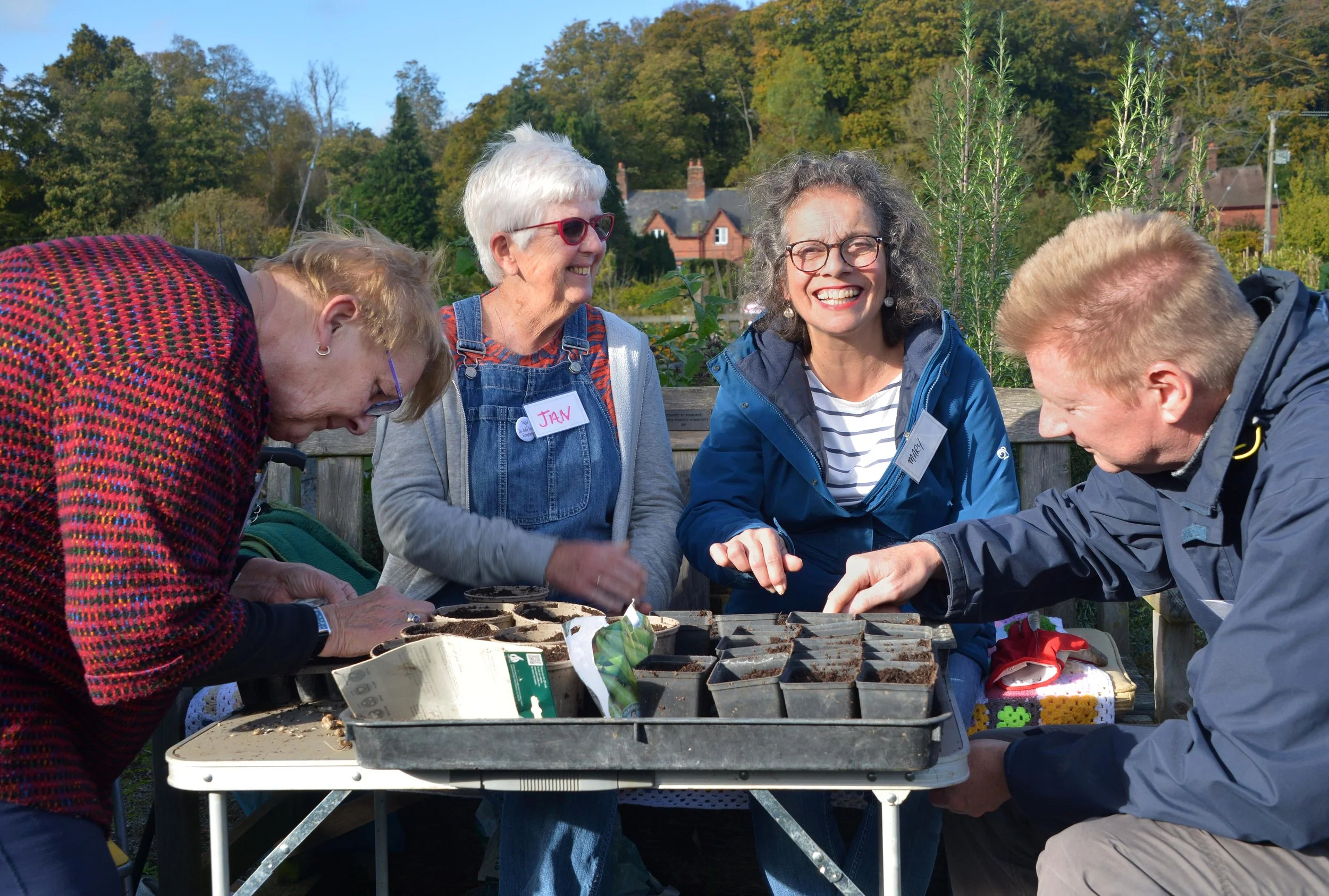 Step Outside Garden Group - In Jolly Good Company - planting seeds.jpg