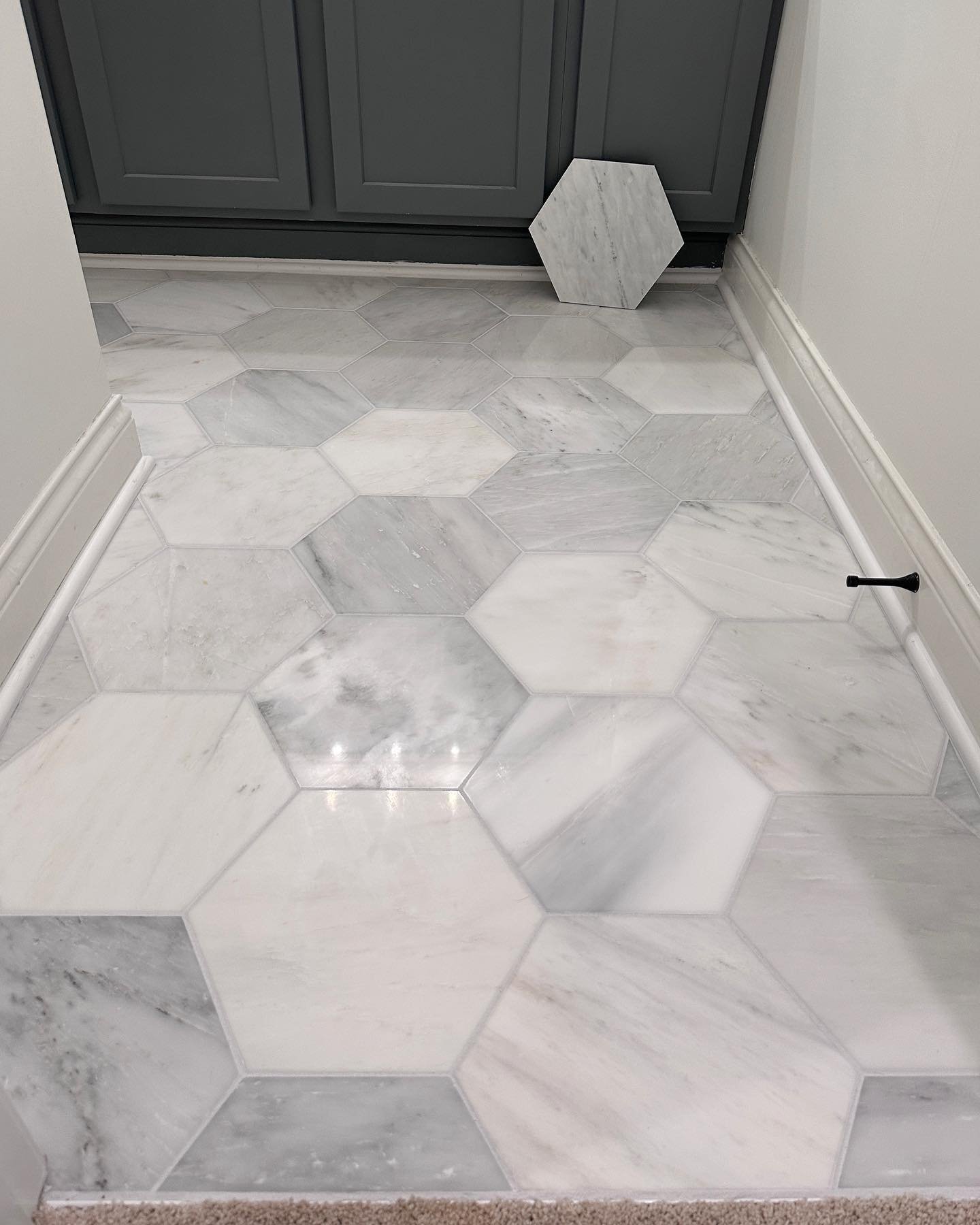 Finishing out the week with a small bathroom marble floor. We love the finished look of this tile and grout color choice. Tile is 12&rdquo; marble hexagon from @thetileshop , grout is Frost from @laticrete. Such a beautiful finish. 10/10 a personal f
