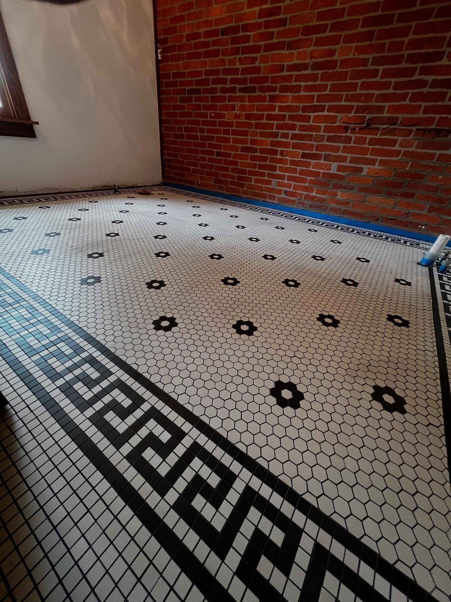 ◾️▫️Looking for tile installers who go above the norm? Look no further! We love an intricate pattern design! Mini hex (1&rdquo;) with a Greek boarder for clients who have been waiting for this install for 10 years!!! They couldn&rsquo;t find anyone t