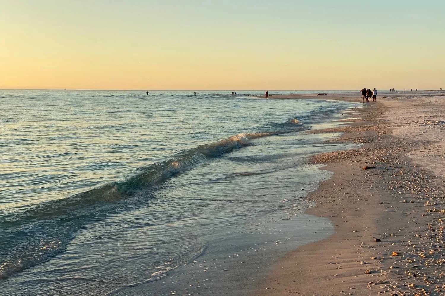 calm sandy beach right before sunset