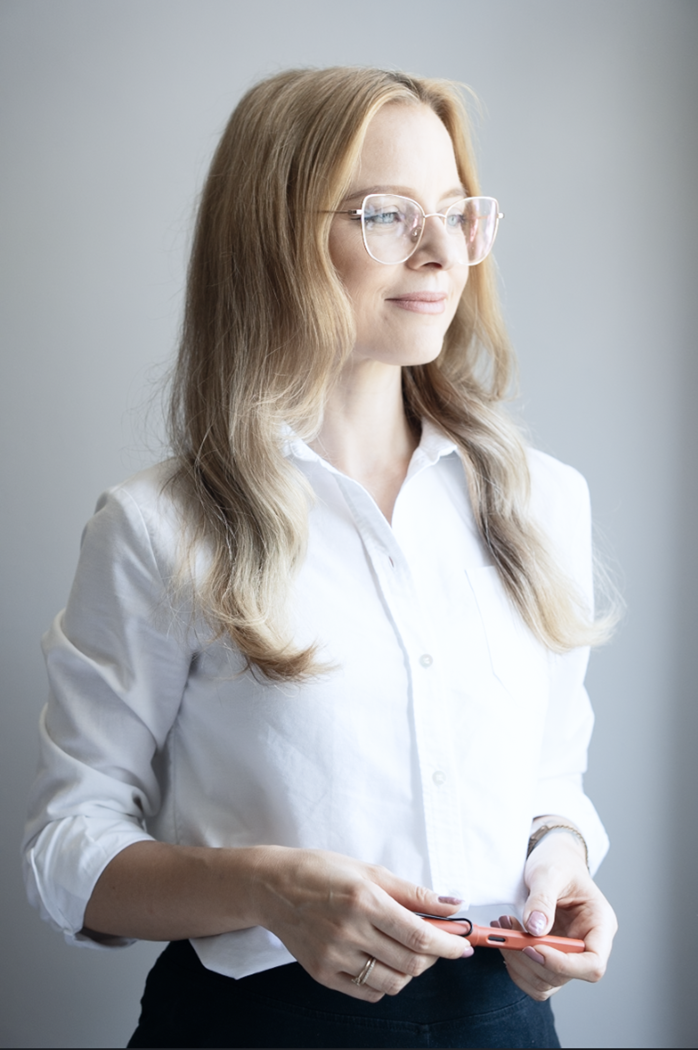 Dr. Kat standing and looking to the right side, slighty smiling