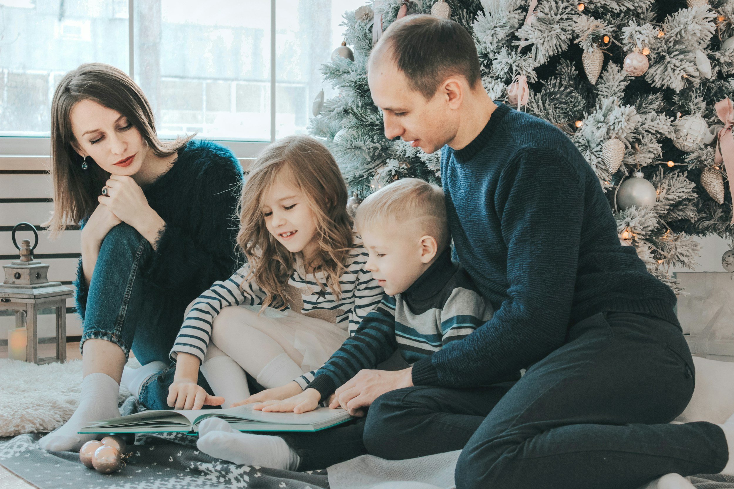 a family reading a book together