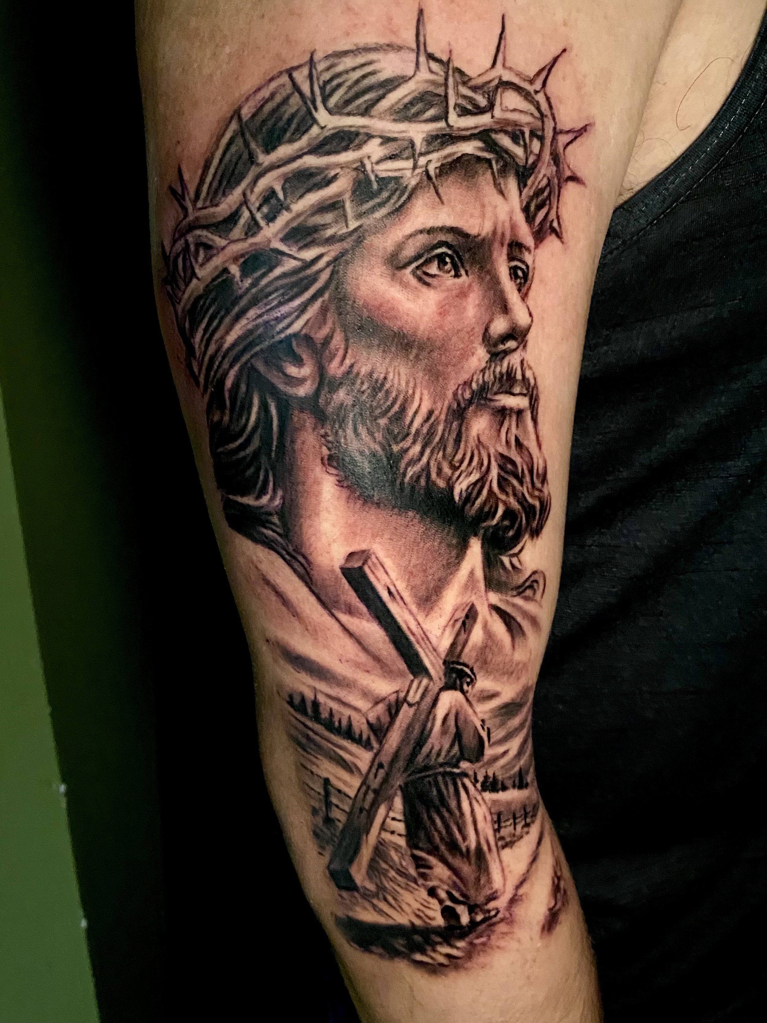 Religious tattoo artist "Shred" tattoo of Jesus and Jesus carrying the cross in black and gray.