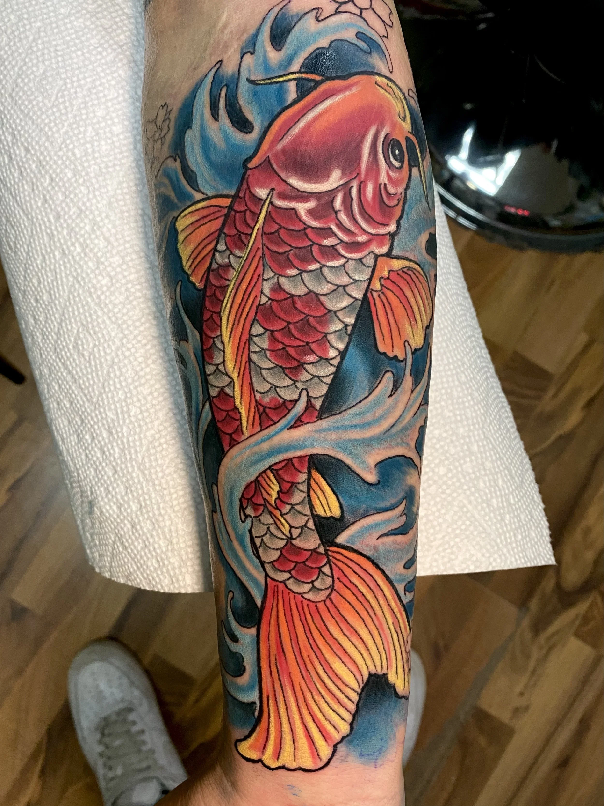 Traditional Koi fish tattoo done by tattoo artist Shred