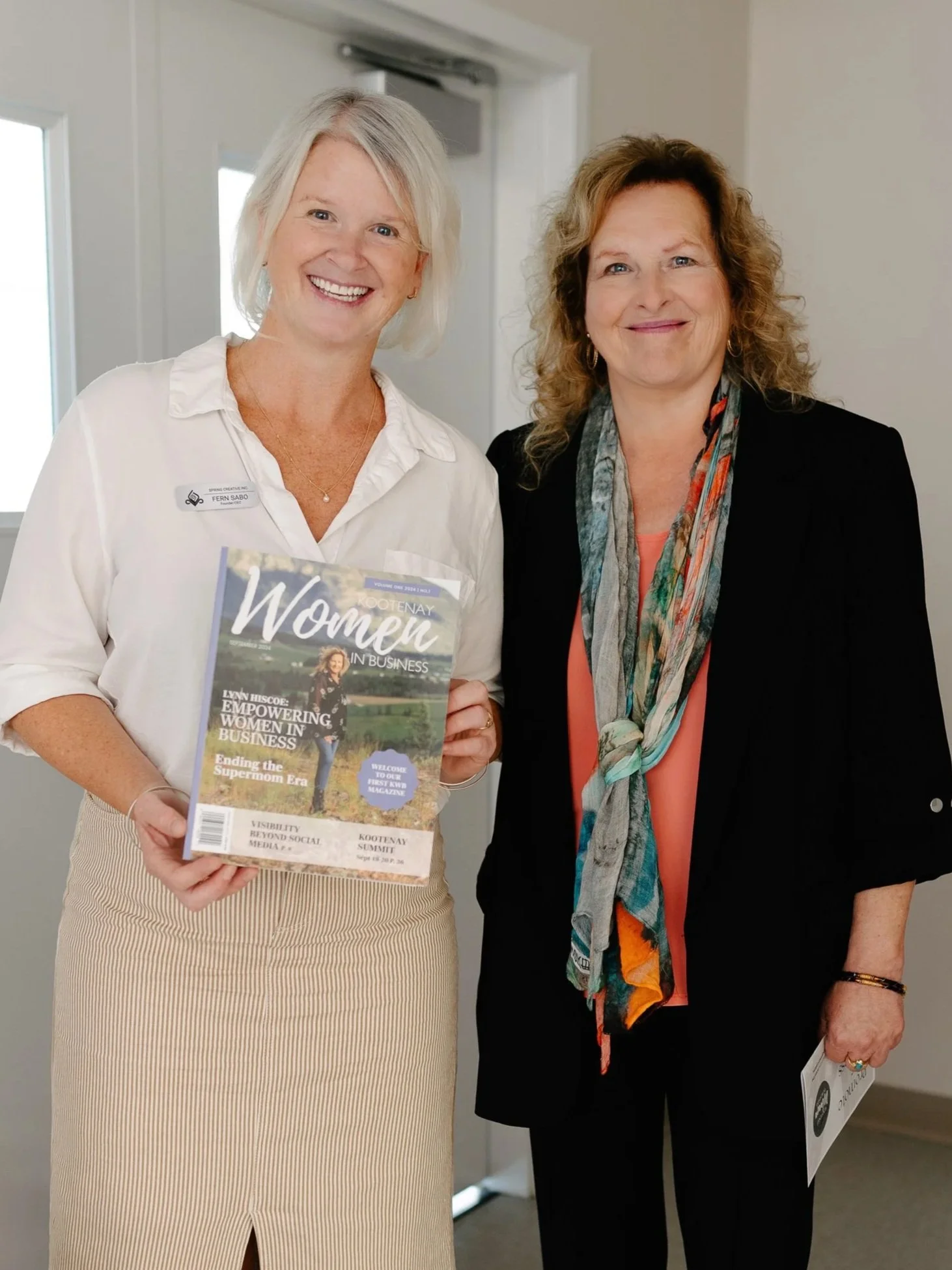 Female entrepreneur reading the latest issue of Kootenay Women In Business Magazine.