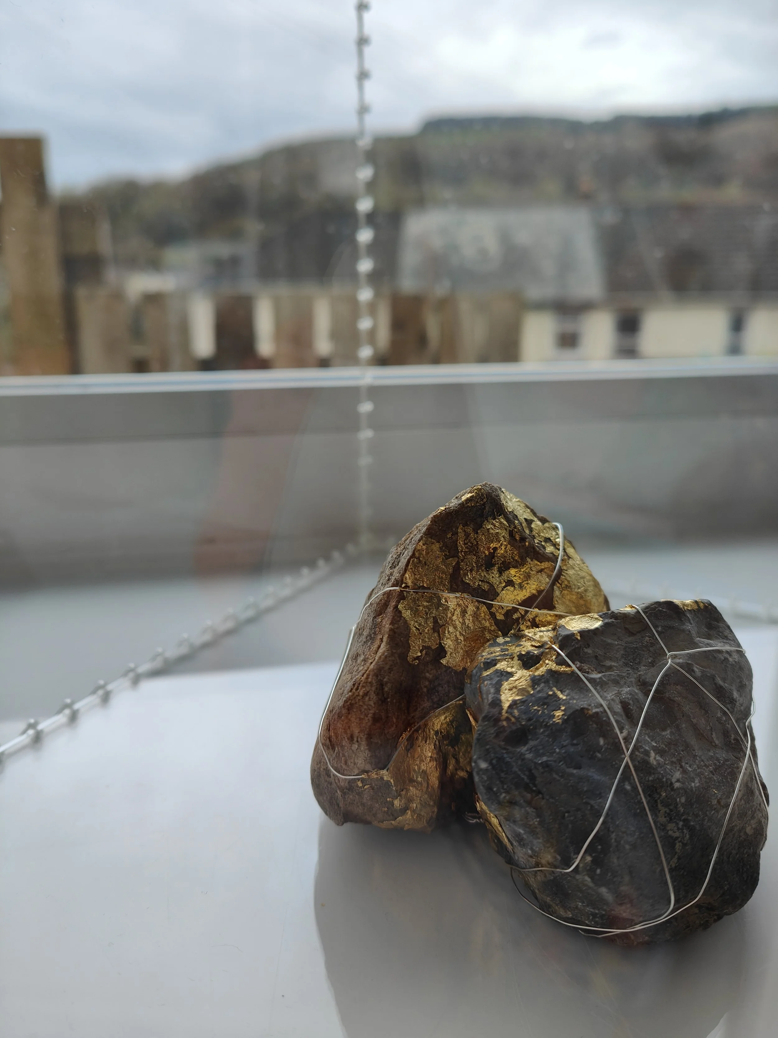 'Burden bound' Acrylic, wire, rock, gold leaf