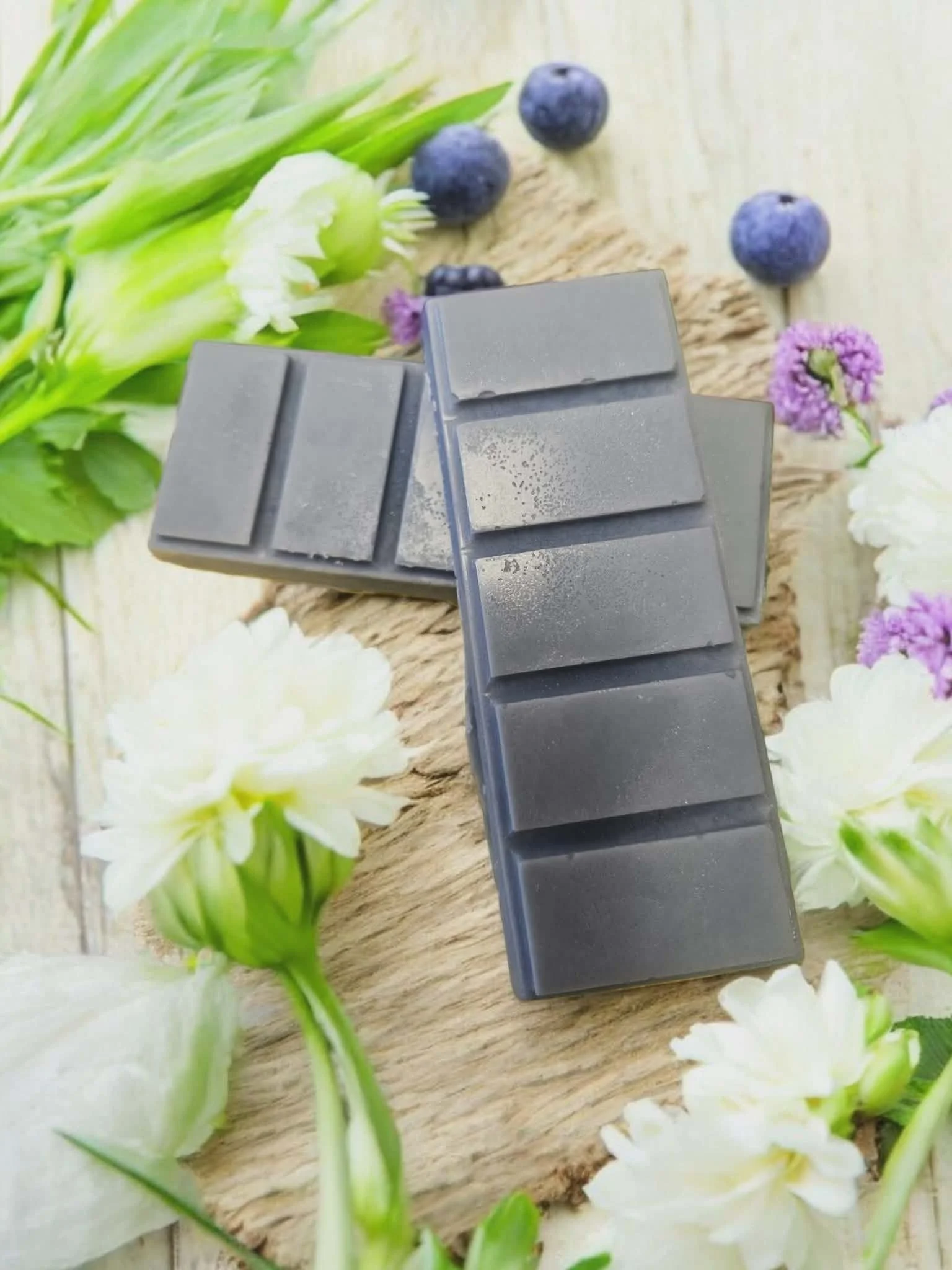 Hand-poured Sugared Blueberries scented wax melt snapbar. Handcrafted in Willard, Ohio by Farmhouse Creations for a sugary blueberry scent