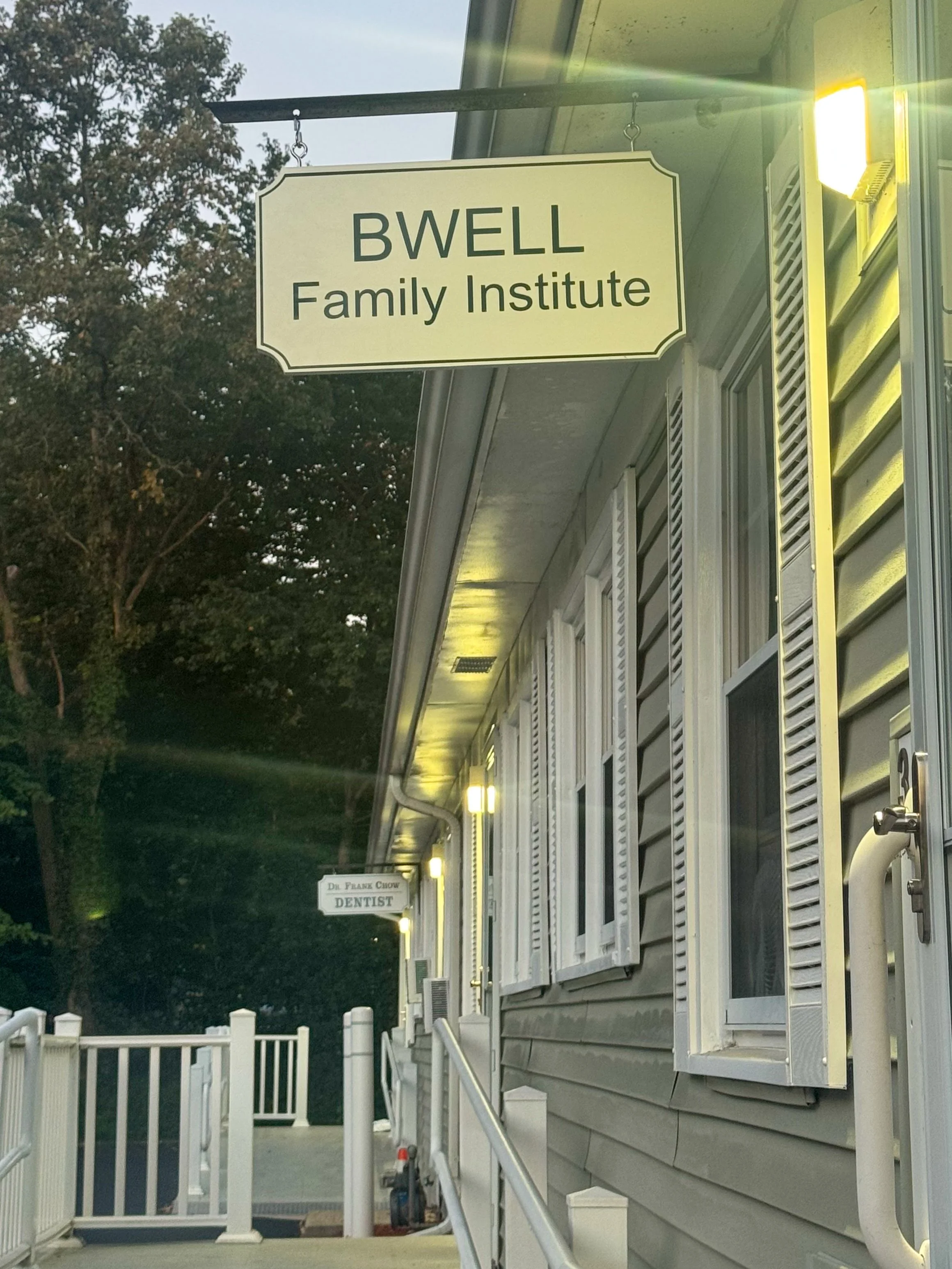 BWell Family Institute sign hanging outside the Merrimac office entrance