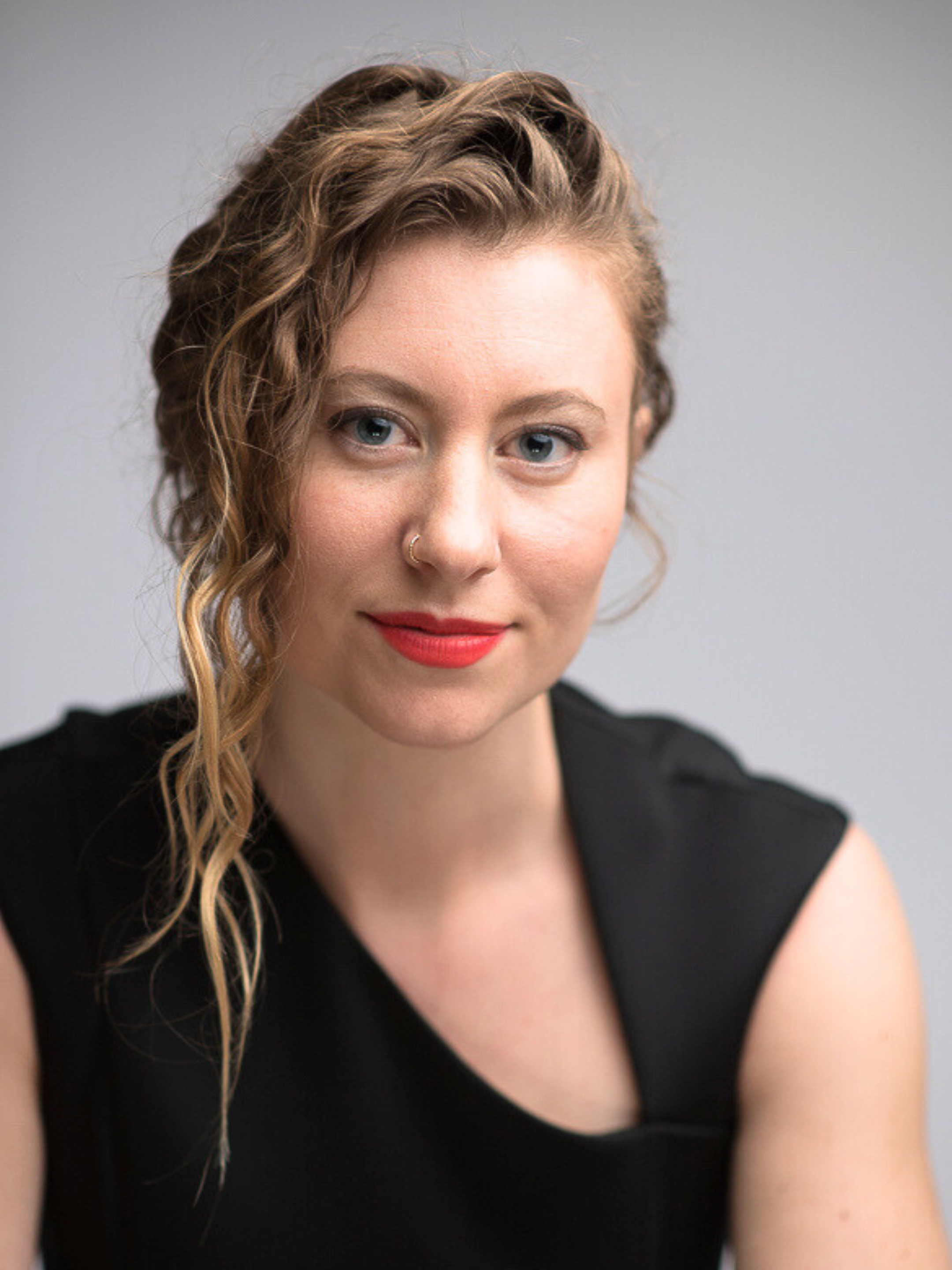 Blonde woman staring straight ahead