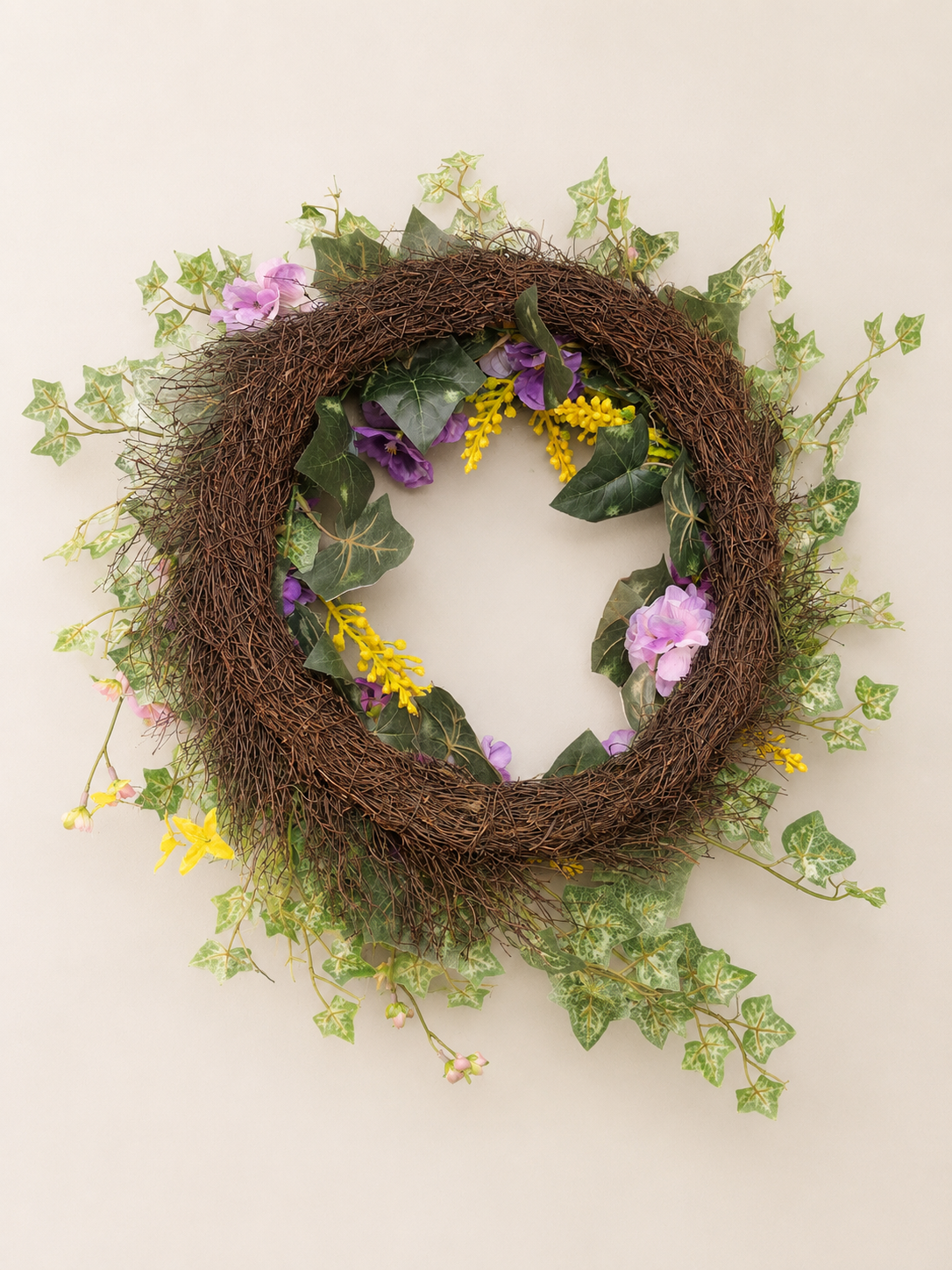 back of Spring wreath with cascading greenery.png