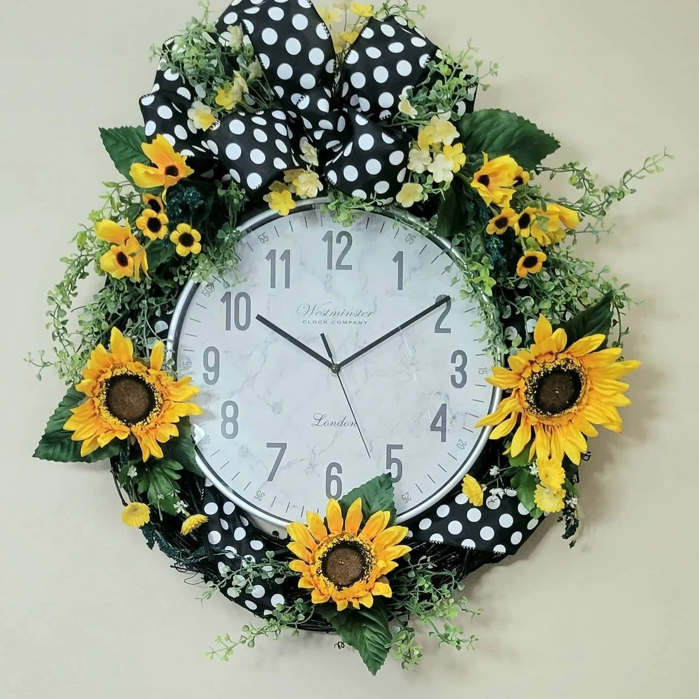 Sunflower grapevine clock wreath on wall
