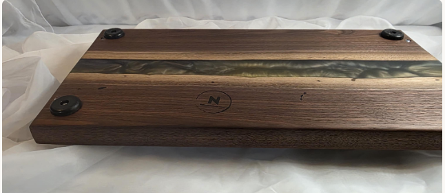 bottom of Luxury black walnut serving board featuring an olive-gold and lavender resin river.png