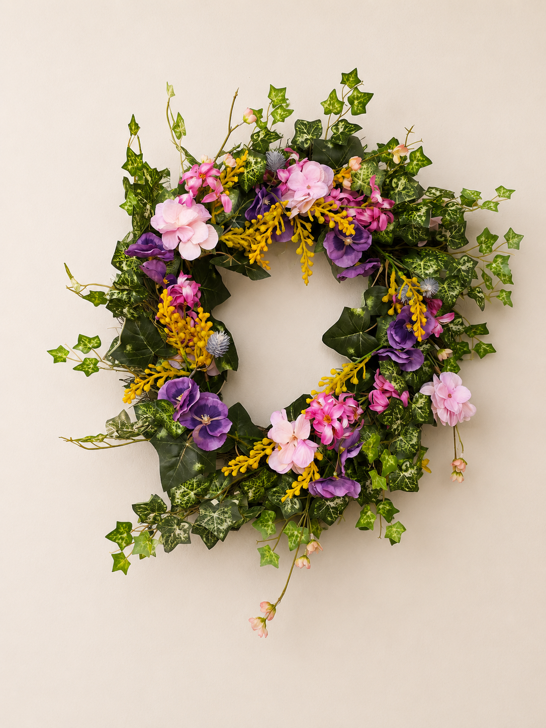 Spring wreath with cascading greenery.png