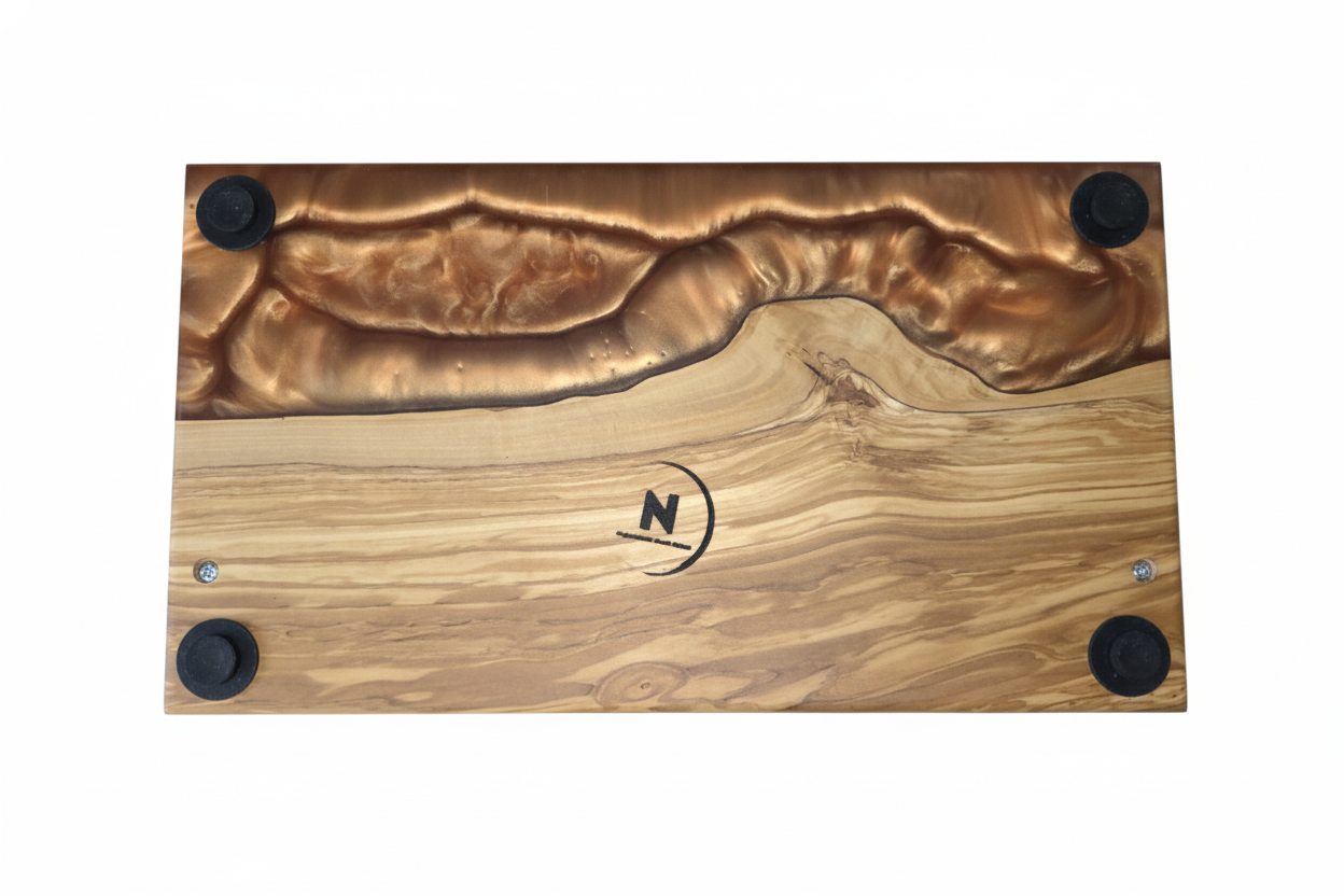 Bottom of Olivewood serving board with copper epoxy.png