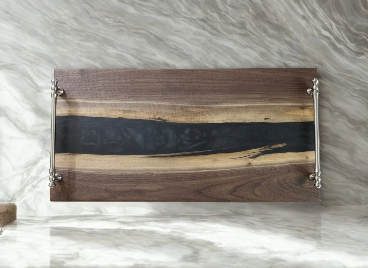 black walnut charcuterie board with black epoxy river and handles.jpg (Copy)