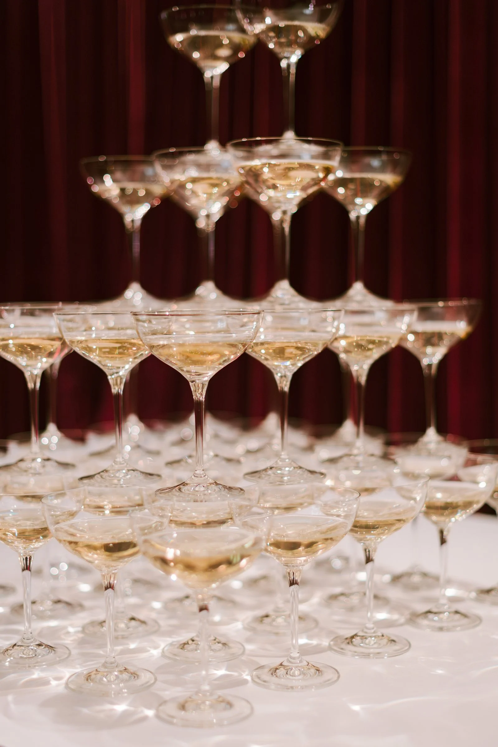 bash-please-utah-investor-community-summit-champagne-coupe-tower-welcome-party-red-velvet-backdrop-luxury-corporate-event.jpg