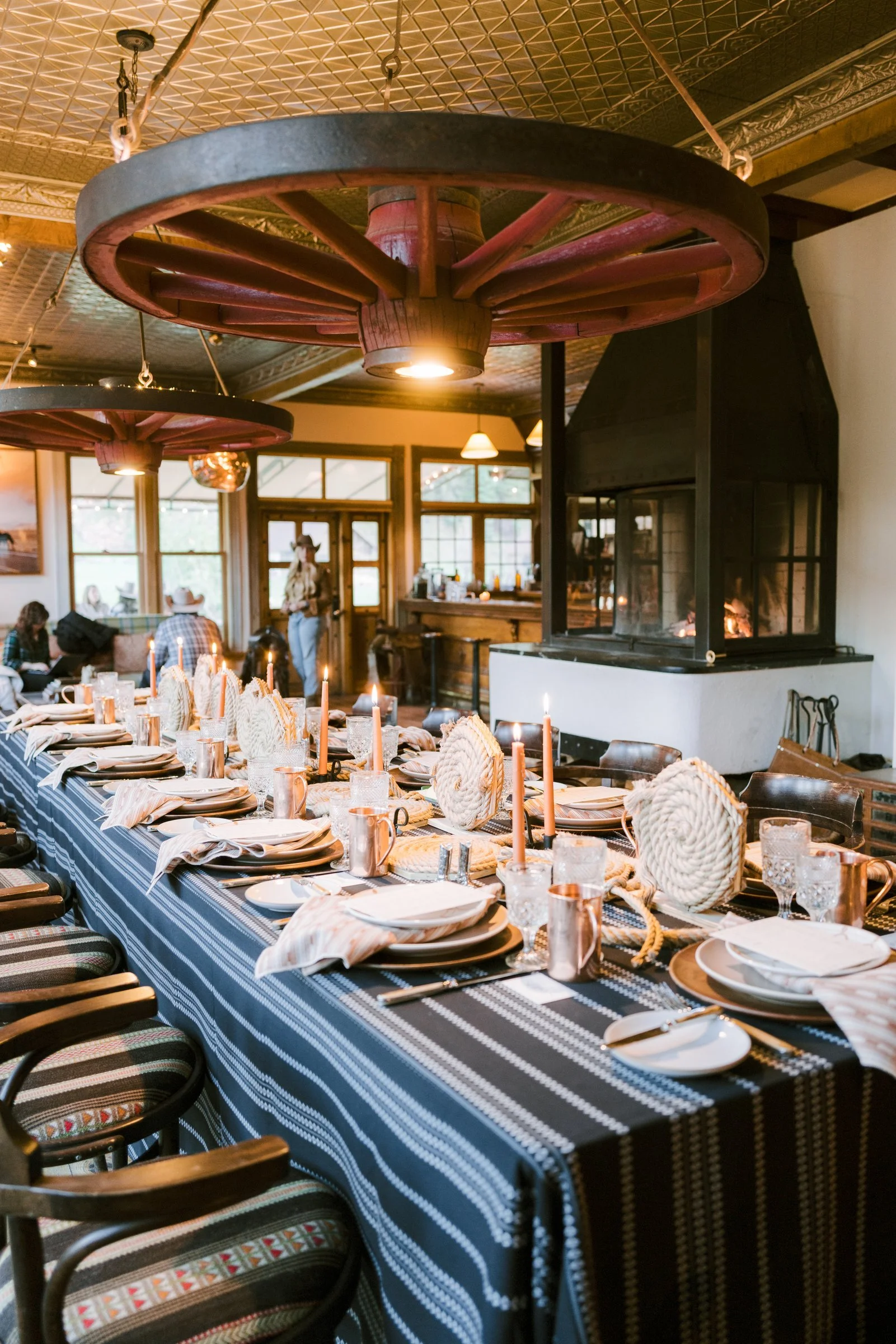 bash-please-dutton-ranch-corporate-retreat-rope-coil-centerpieces-wagon-wheel-chandelier-saloon-dinner-dutton-ranch-luxury-corporate-offsite.jpg
