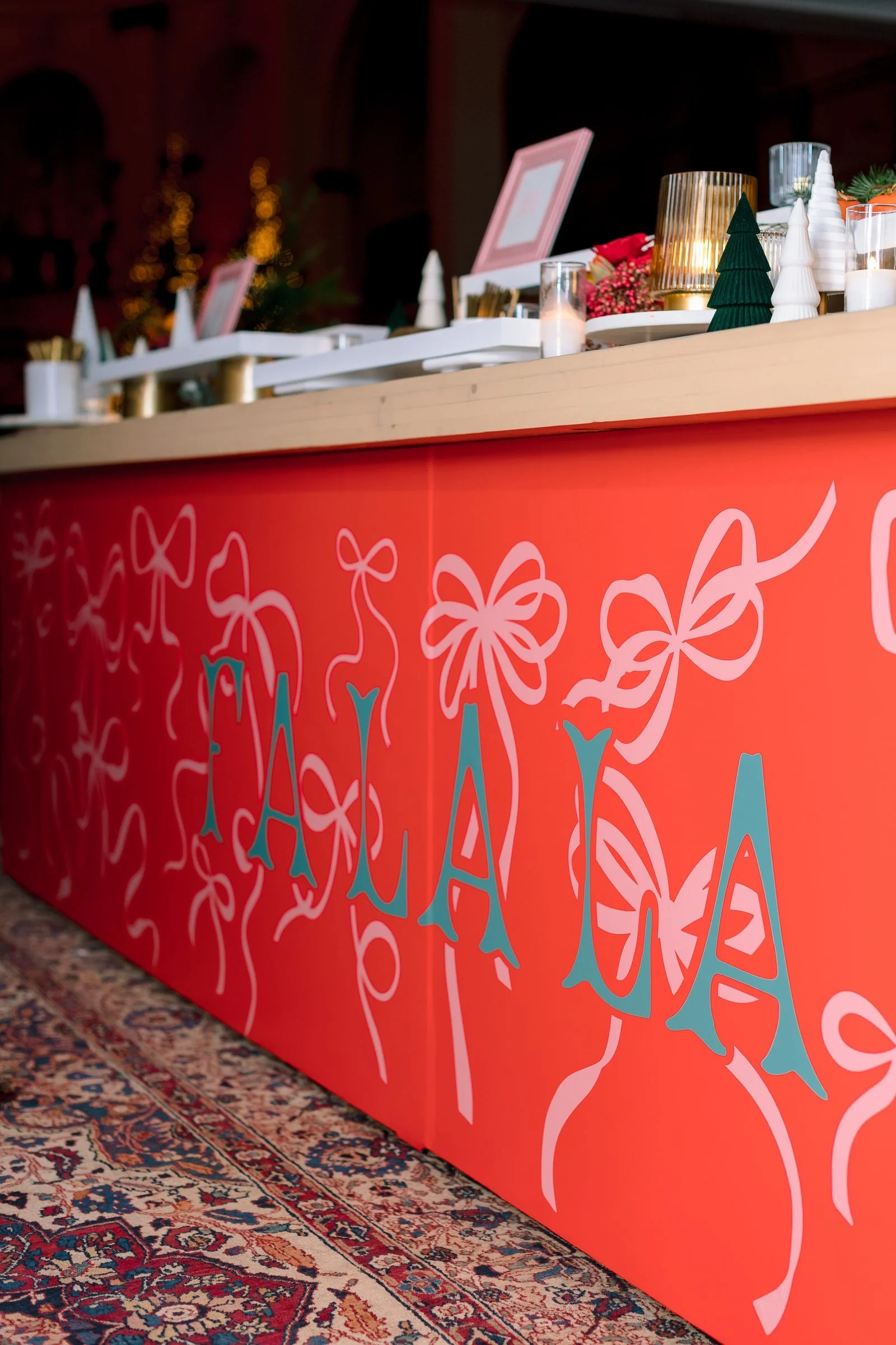 bay-area-corporate-holiday-party-custom-fa-la-la-bar-front-hand-drawn-ribbon-bows-red-holiday-party-bar-design-san-francisco.jpg