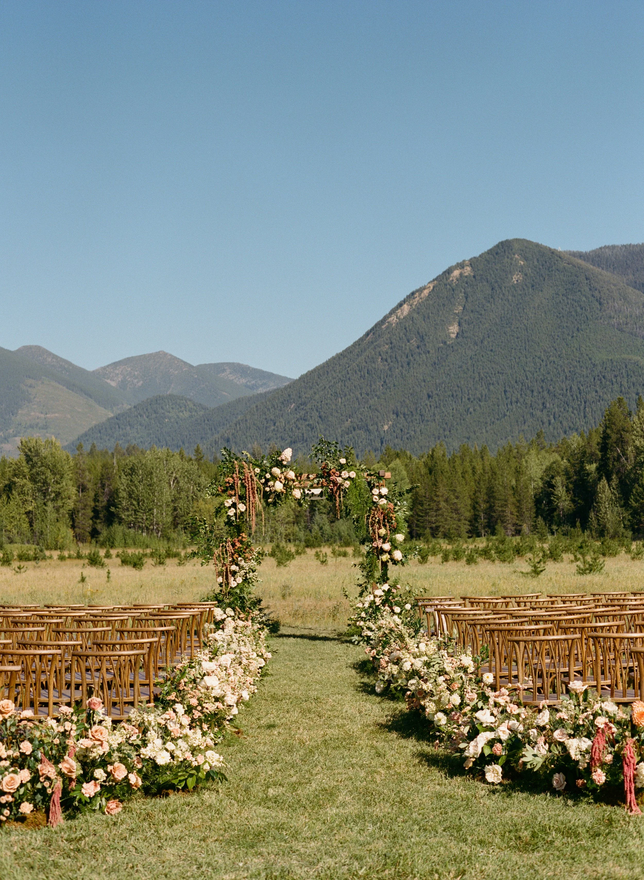 Floral adorned wedding ceremony outside in Montana
