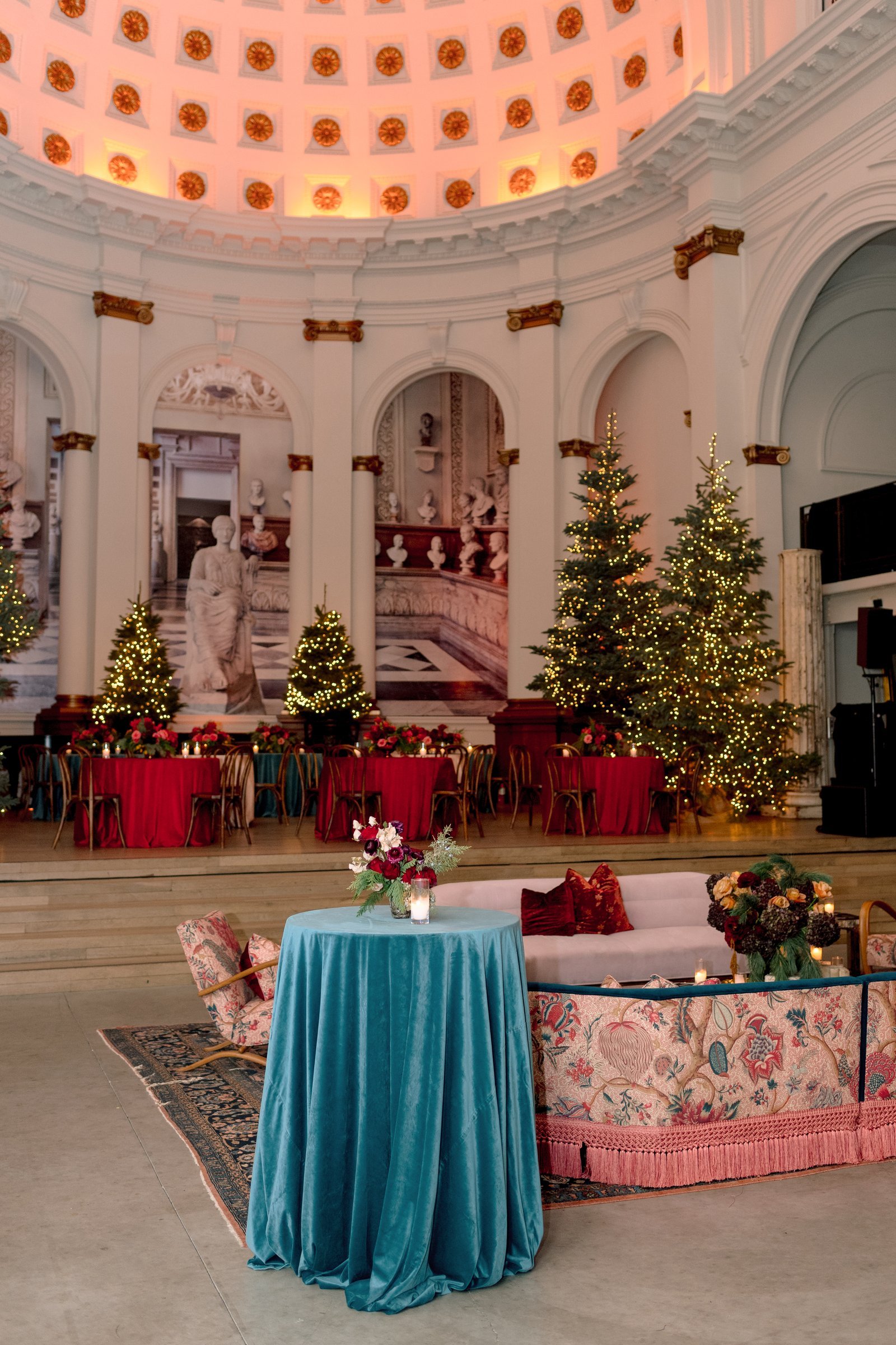 bay-area-corporate-holiday-party-domed-rotunda-holiday-party-san-francisco-velvet-cocktail-table-lit-evergreen-trees-lounge-seating.jpg