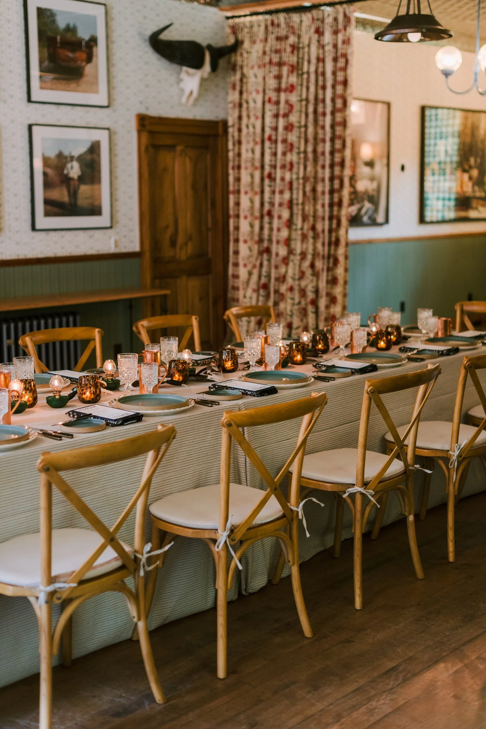 bash-please-dutton-hot-springs-corporate-retreat-rustic-saloon-dinner-table-cross-back-chairs-copper-mugs-high-end-corporate-event-planning.jpg