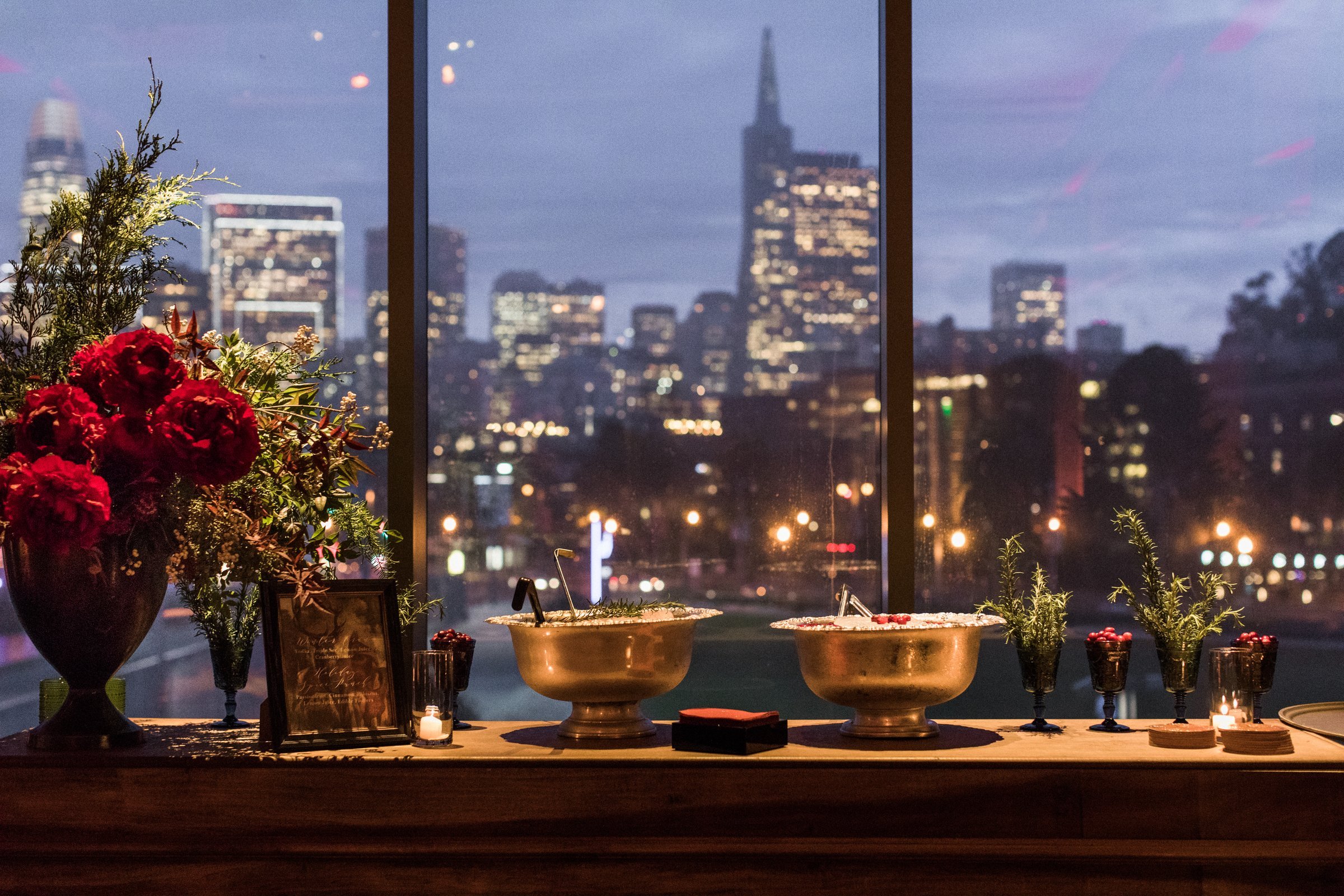 bay-area-corporate-holiday-party-holiday-cocktail-bar-san-francisco-skyline-views-red-peonies-winter-greenery-signature-cocktail-punch.jpg
