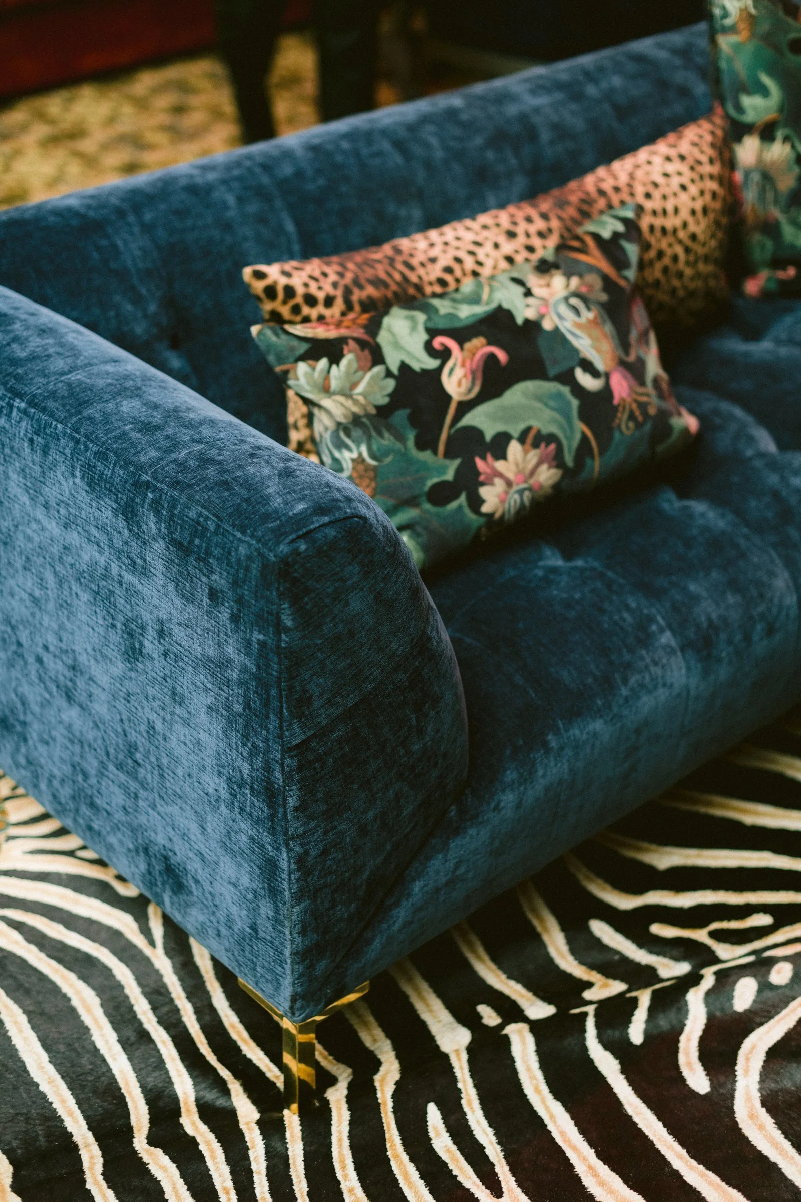 bash-please-utah-investor-community-summit-navy-velvet-lounge-chair-leopard-botanical-pillows-zebra-rug-supper-club-furnishings.jpg