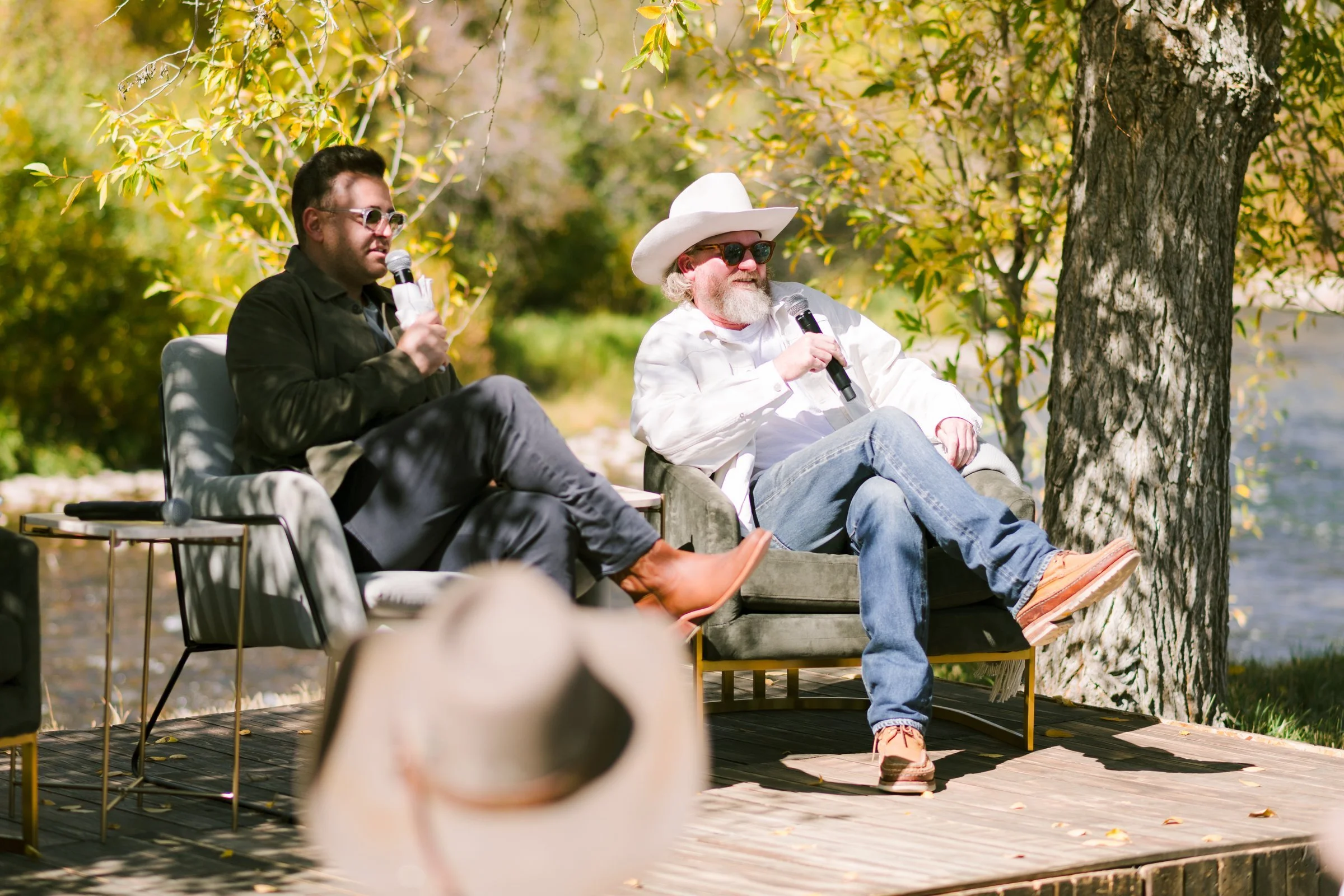 bash-please-utah-investor-community-summit-investor-community-summit-speakers-riverside-stage-western-style-lounge-seating.jpg