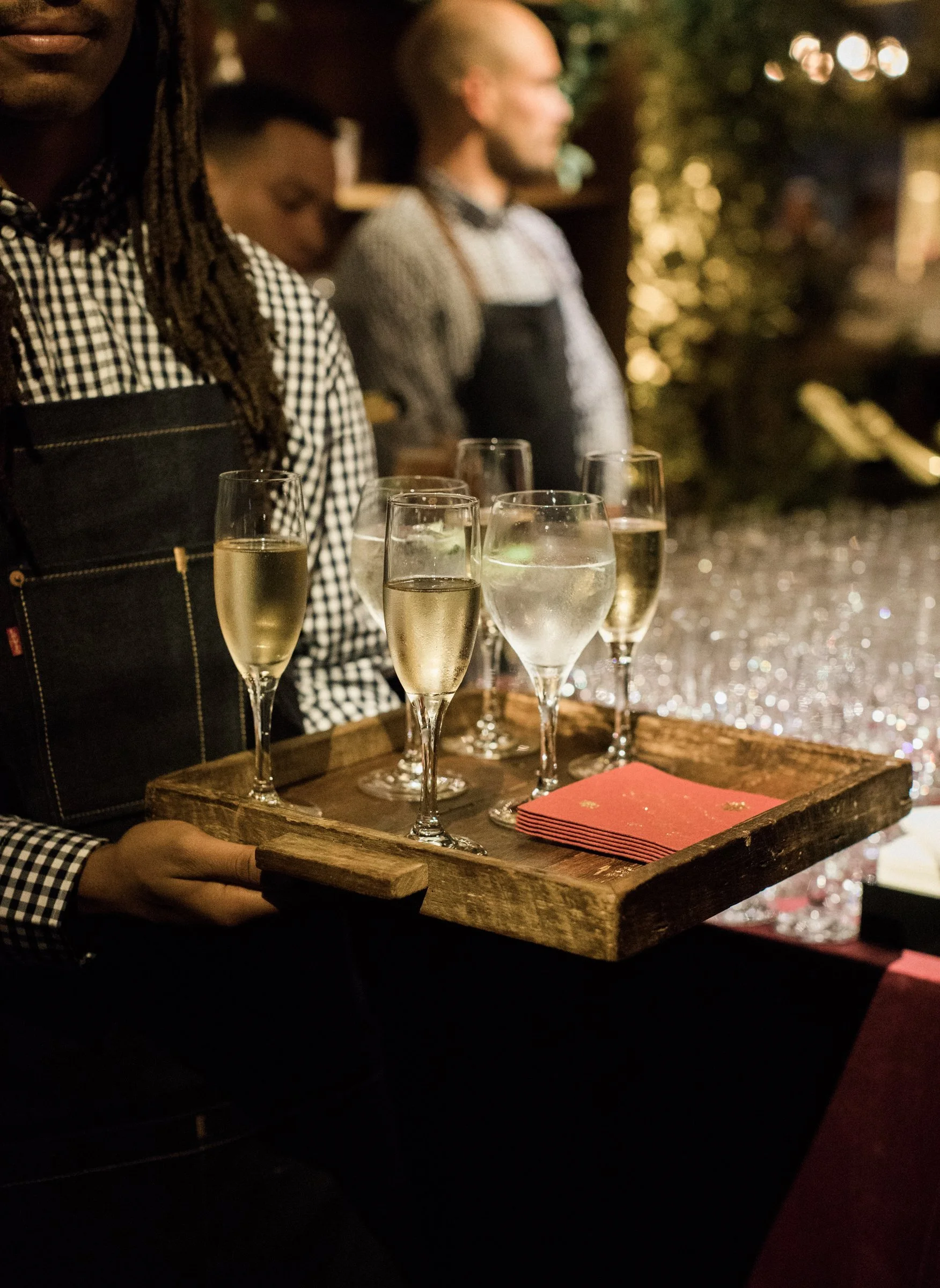 bay-area-corporate-holiday-party-passed-champagne-reclaimed-wood-tray-holiday-reception-bartenders-denim-aprons-bay-area-corporate-event.jpg