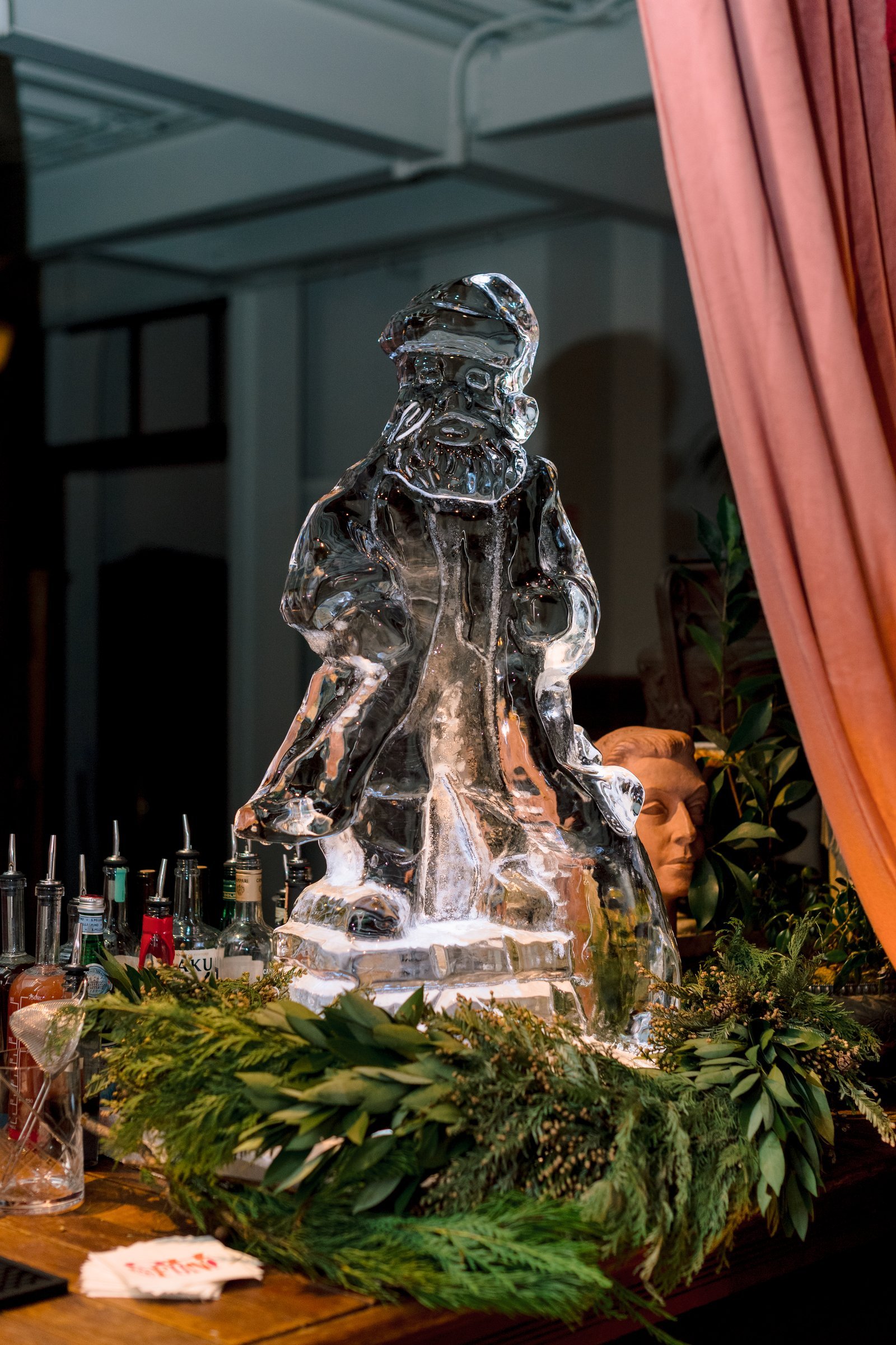 bay-area-corporate-holiday-party-hand-carved-ice-sculpture-santa-holiday-cocktail-bar-evergreen-garland-corporate-party-bay-area.jpg