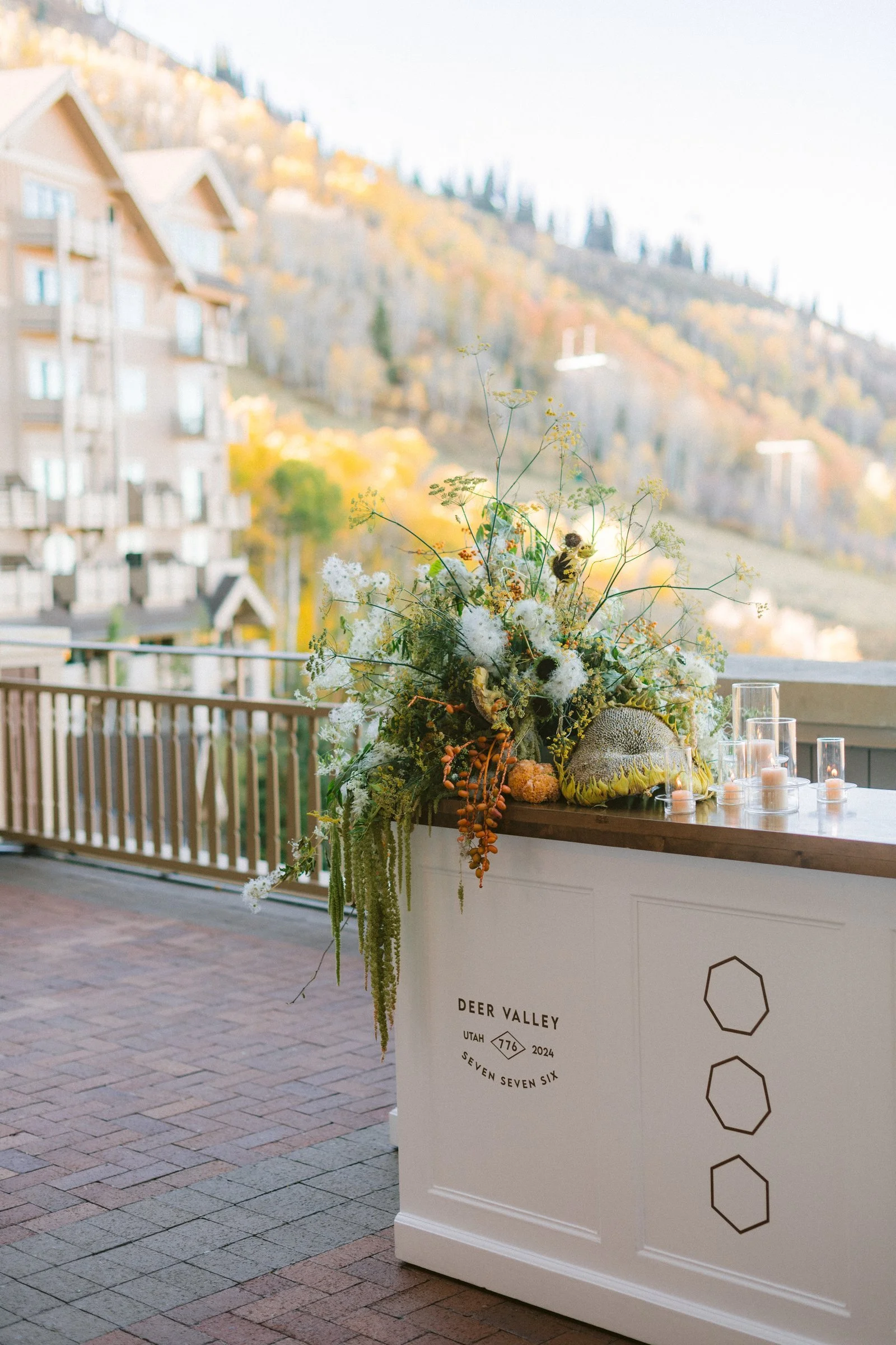 bash-please-utah-investor-community-summit-custom-welcome-bar-wildflower-sunflower-floral-installation-fall-foliage-mountain-backdrop-deer-valley.jpg
