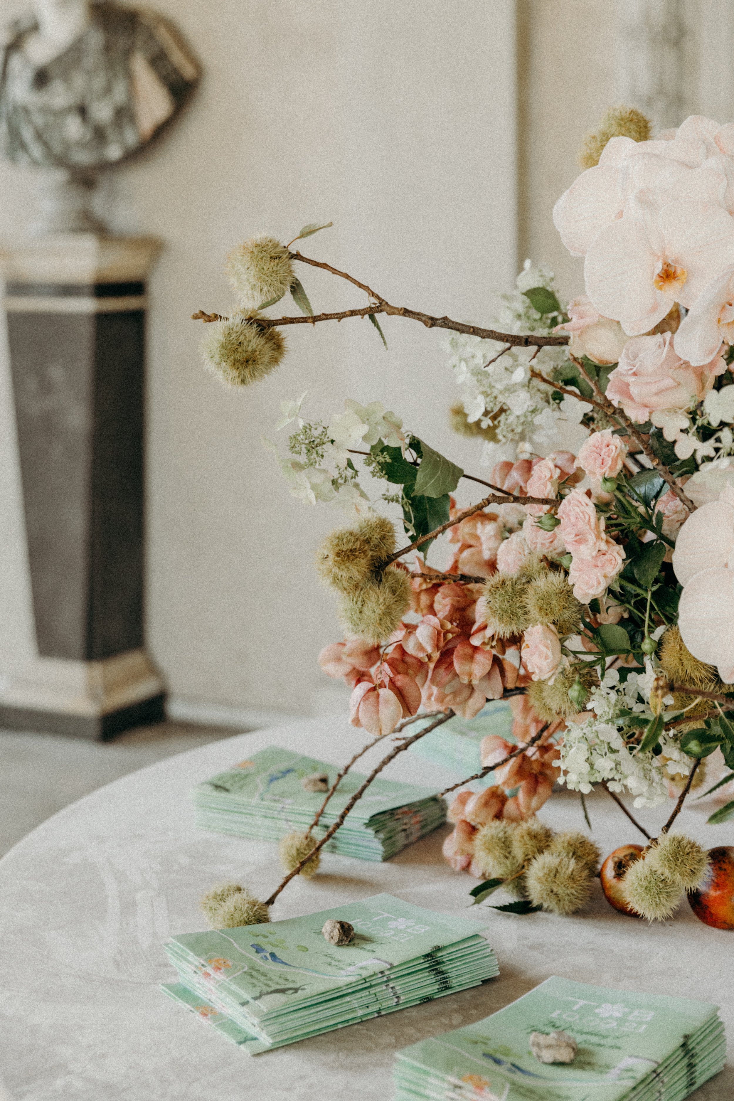 Floral installation detail from a Bash Please–designed event, featuring soft pink blooms and natural textures.