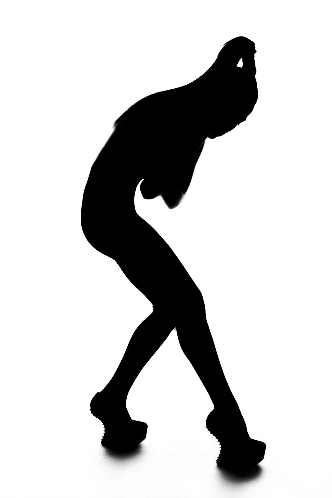 Silhouette of a woman skating, with a white background.