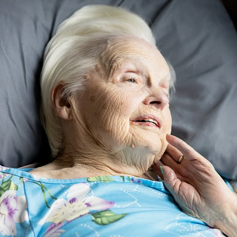 My mom gazing out her bedroom window in the final days of her life.