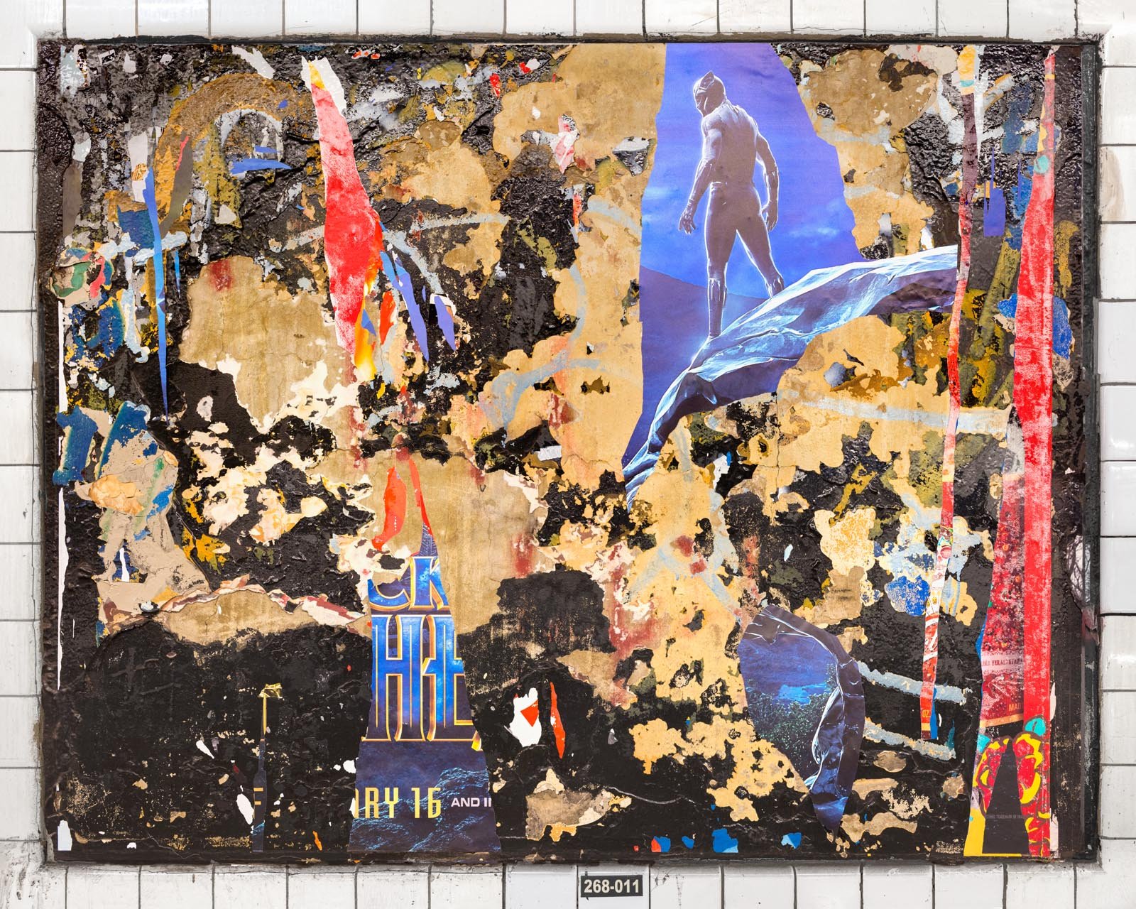 A photograph of a New York City subway advertising panel, containing posters torn by street artists and subway riders to create collage-like compositions.  Shot by Barton Lewis, capturing continuously mutating surfaces transformed into art by street 
