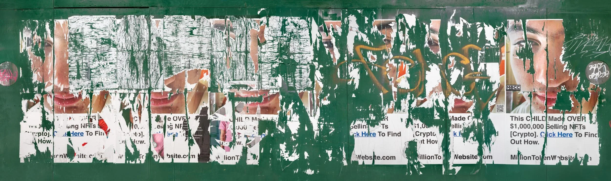 Fine art urban photography capturing decaying advertising posters on a plywood construction site fence. The composition isolates layers of shredded commercial paper, weathered textures, and accidental street art by Barton Lewis.