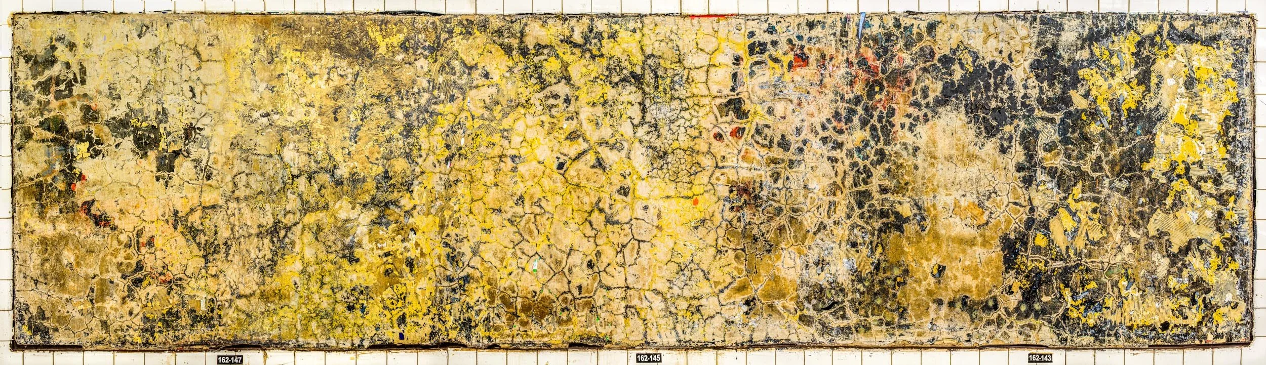 A photograph of a New York City subway advertising panel, showcasing urban decay transformed into fine art. Photographed by Barton Lewis, the image focuses on minimalist, painterly textures, poster fragments, heavily scraped surfaces and faded pigmen