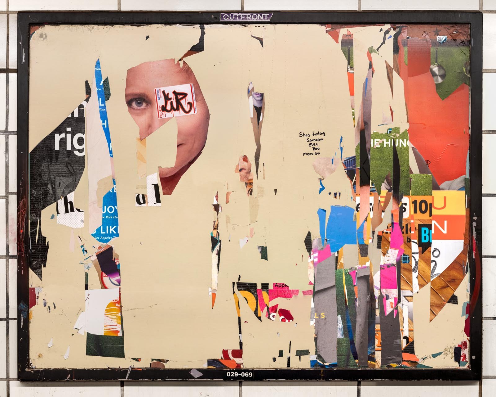 A photograph of a New York City subway advertising panel, containing posters torn by street artists and subway riders to create collage-like compositions.  Shot by Barton Lewis, capturing continuously mutating surfaces transformed into art by street 