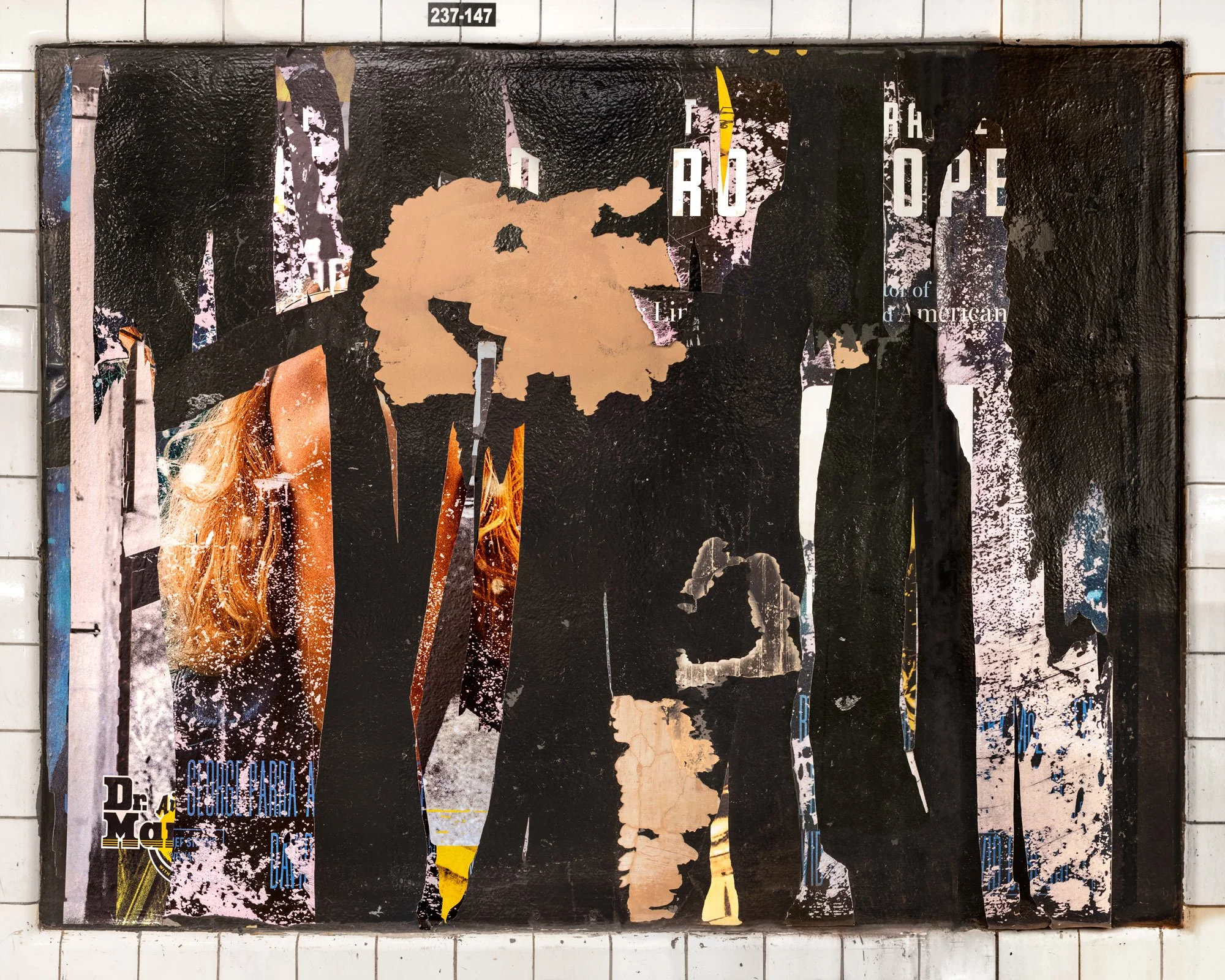 Fine art photography print of deeply layered, torn advertising posters on a New York City subway wall. This urban collage composition highlights fragmented typography, shredded paper textures, and weathered street media captured by contemporary artis