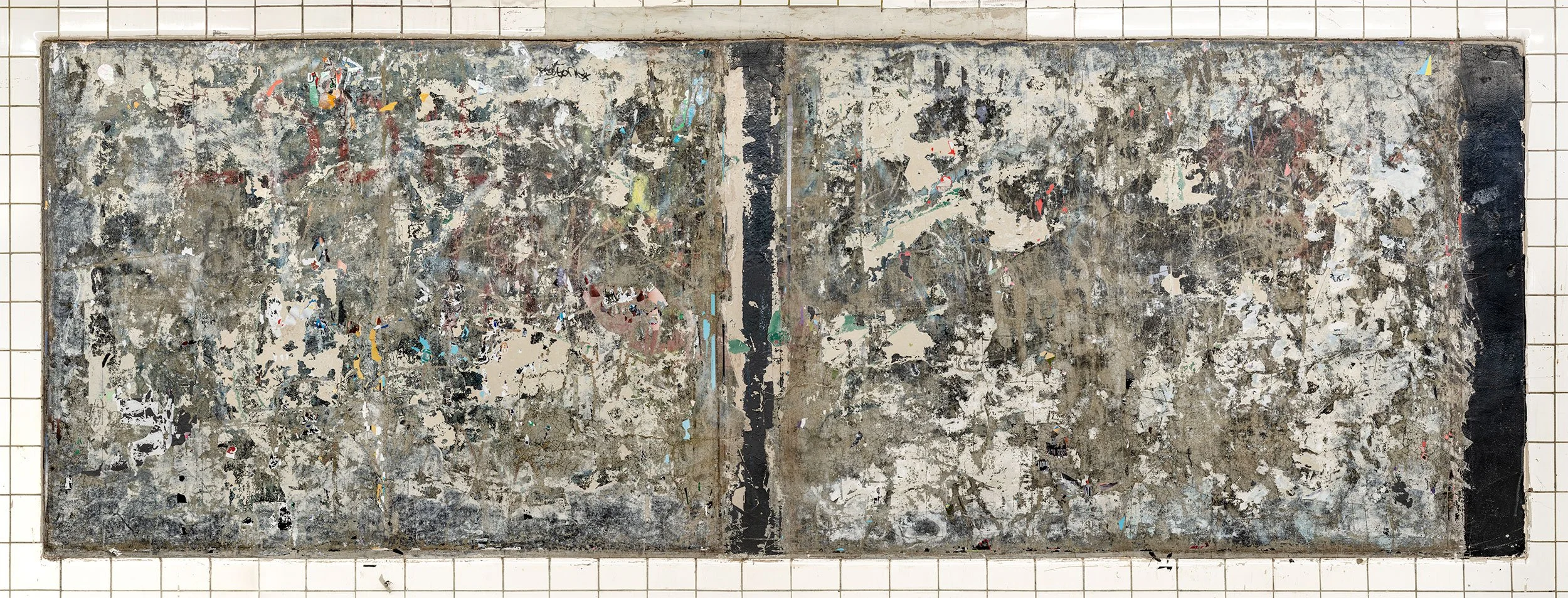 A "wall cut" or ad panel in the New York City subway, featuring a bare cement wall scraped of layers of posters with scraps of paper, chipped paint, and graffiti creating a densely textured composition reminiscent of abstract expressionist art.