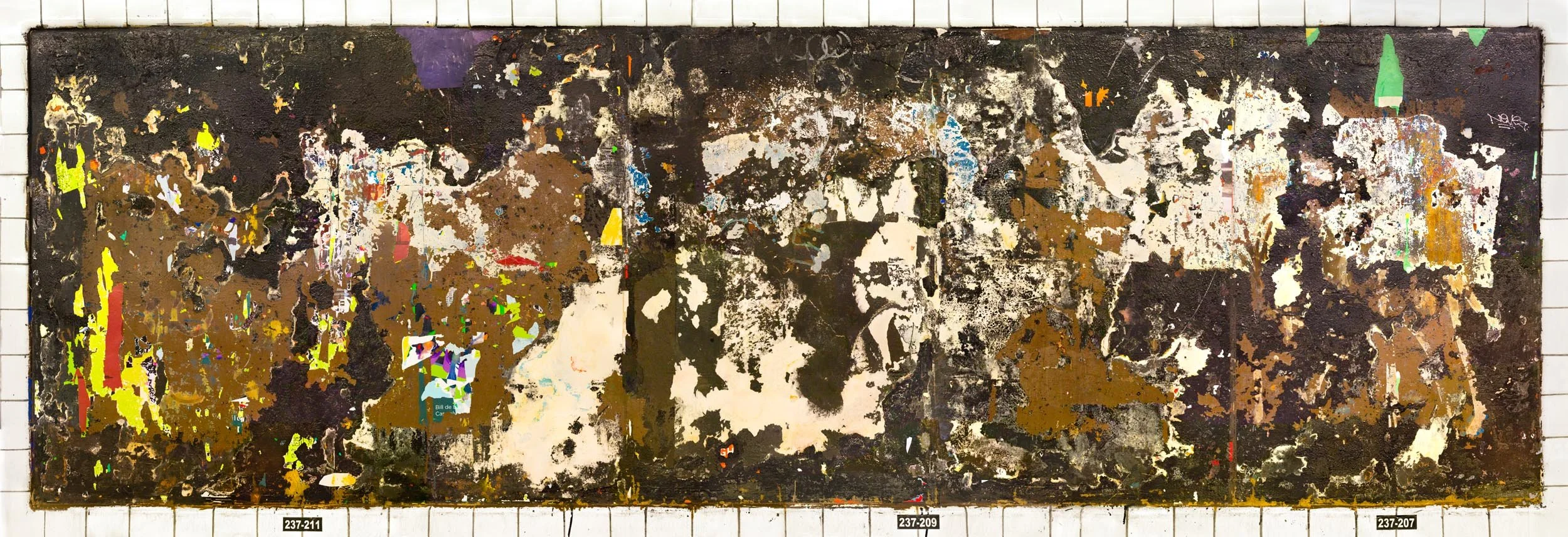 A photograph of a New York City subway advertising panel, showcasing urban decay transformed into fine art. Photographed by Barton Lewis, the image focuses on minimalist, painterly textures, poster fragments, heavily scraped surfaces and faded pigmen